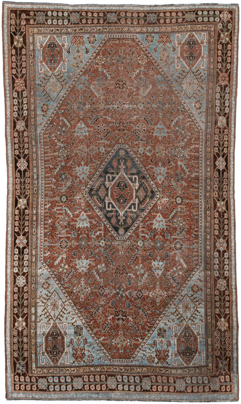 4' x 7' one-of-a-kind handmade vintage Qashqai rug. Color palette: terra cotta, pale blue, ivory, dark brown, slate, taupe