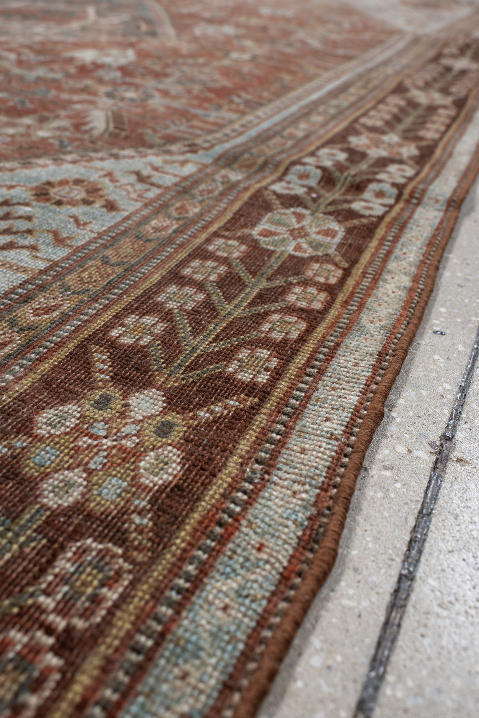 4' x 7' one-of-a-kind handmade vintage Qashqai rug. Color palette: terra cotta, pale blue, ivory, dark brown, slate, taupe