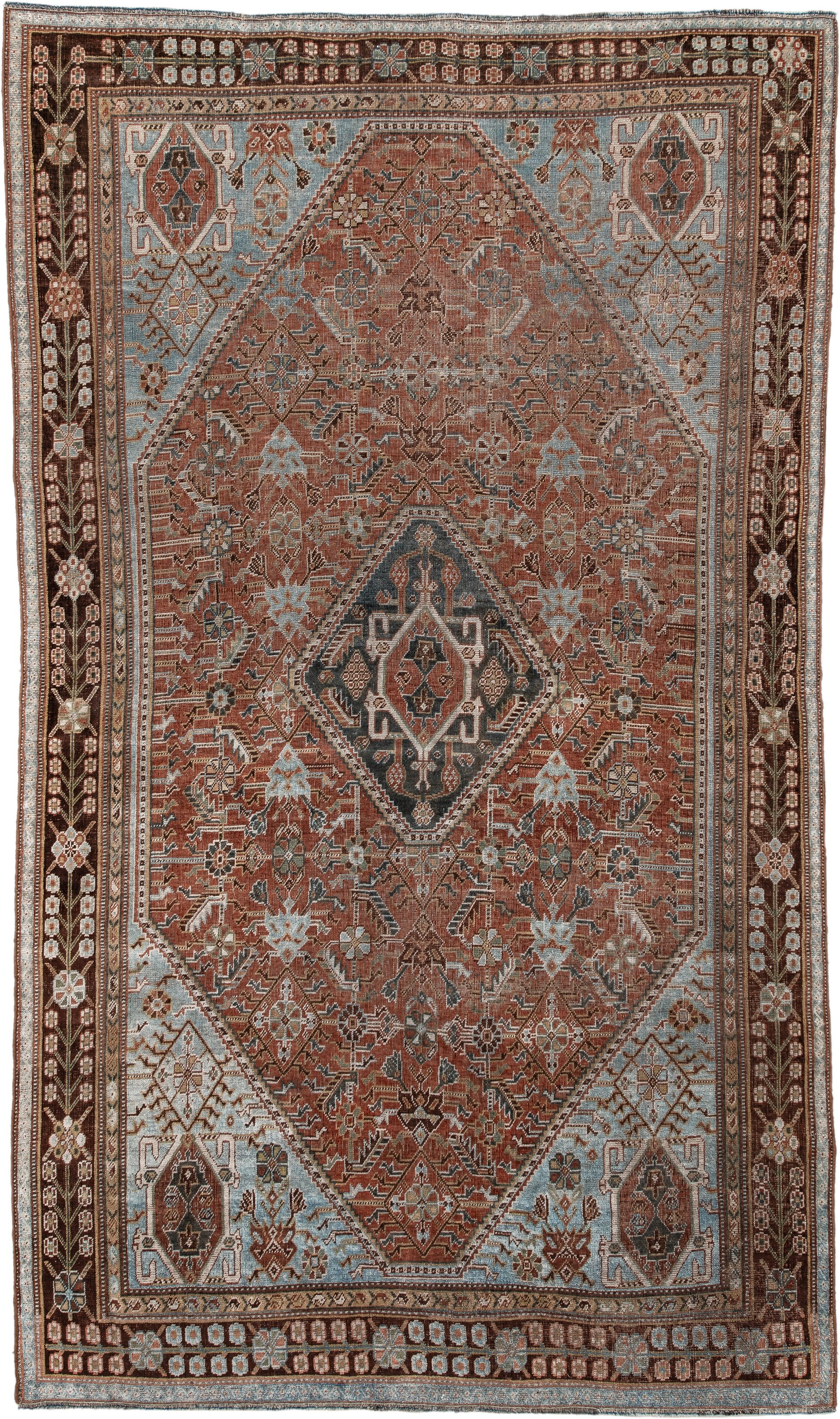 4' x 7' one-of-a-kind handmade vintage Qashqai rug. Color palette: terra cotta, pale blue, ivory, dark brown, slate, taupe