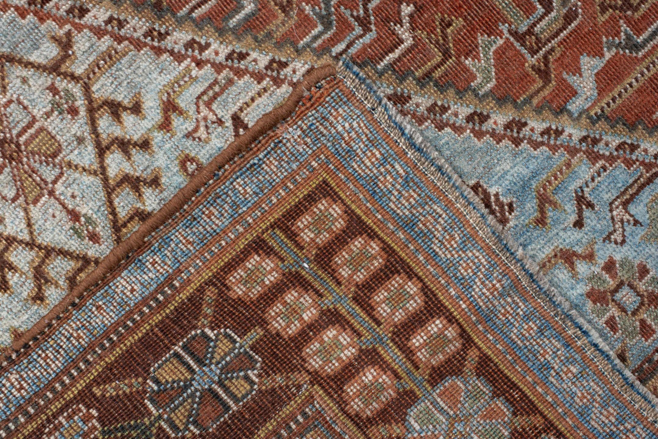 4' x 7' one-of-a-kind handmade vintage Qashqai rug. Color palette: terra cotta, pale blue, ivory, dark brown, slate, taupe