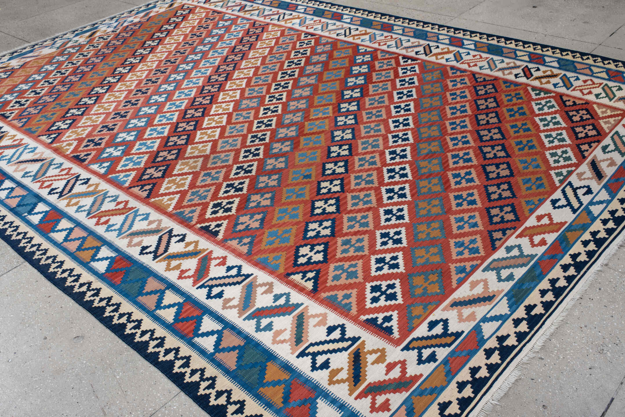 9' x 13' one-of-a-kind handmade vintage Kilim large size rug. Color palette: terracotta, ivory, navy, sky_blue, gold, teal