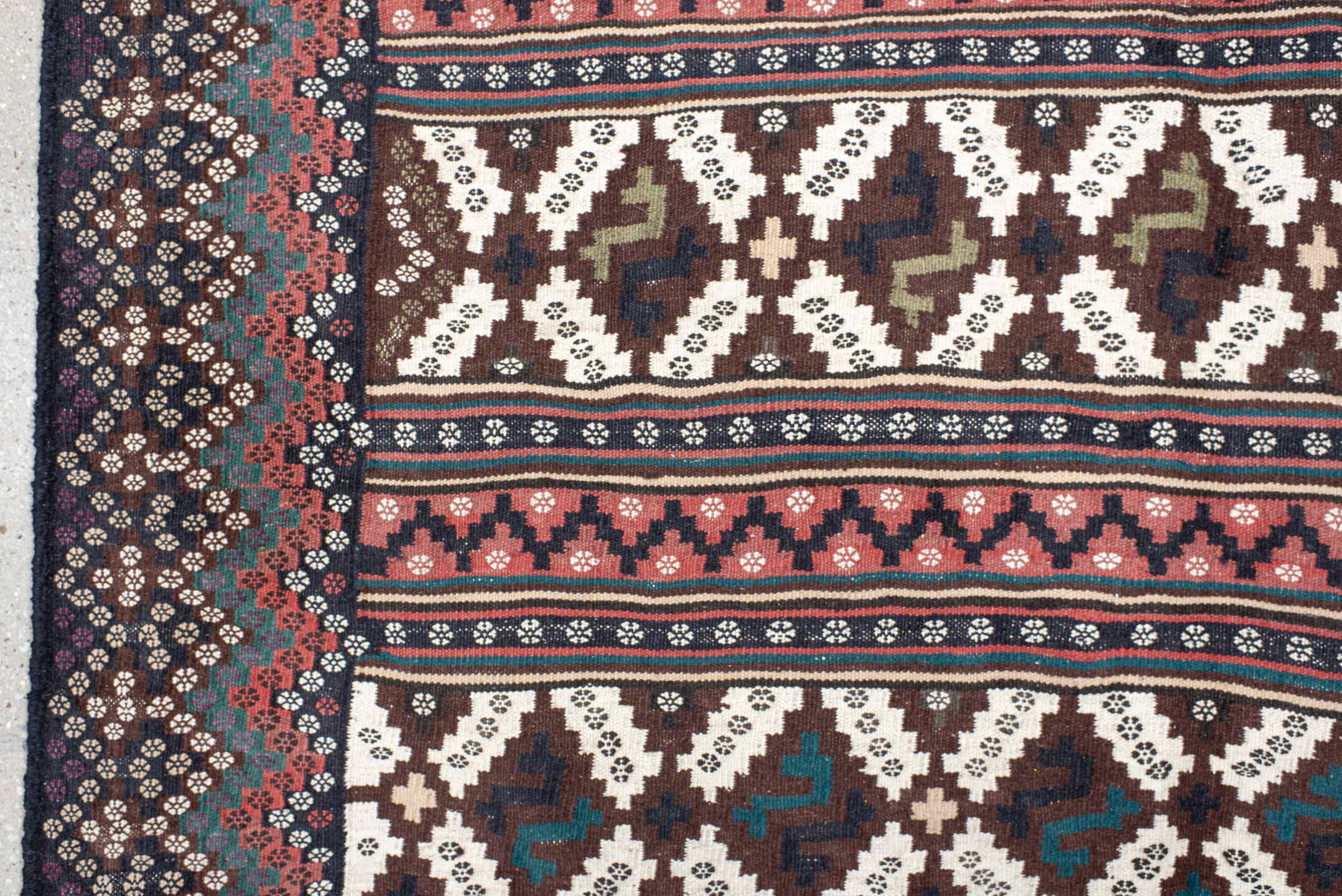 5' x 7' one-of-a-kind handmade vintage Kilim rug. Color palette: brown, ivory, rose, teal, charcoal, olive, pink, red, gray