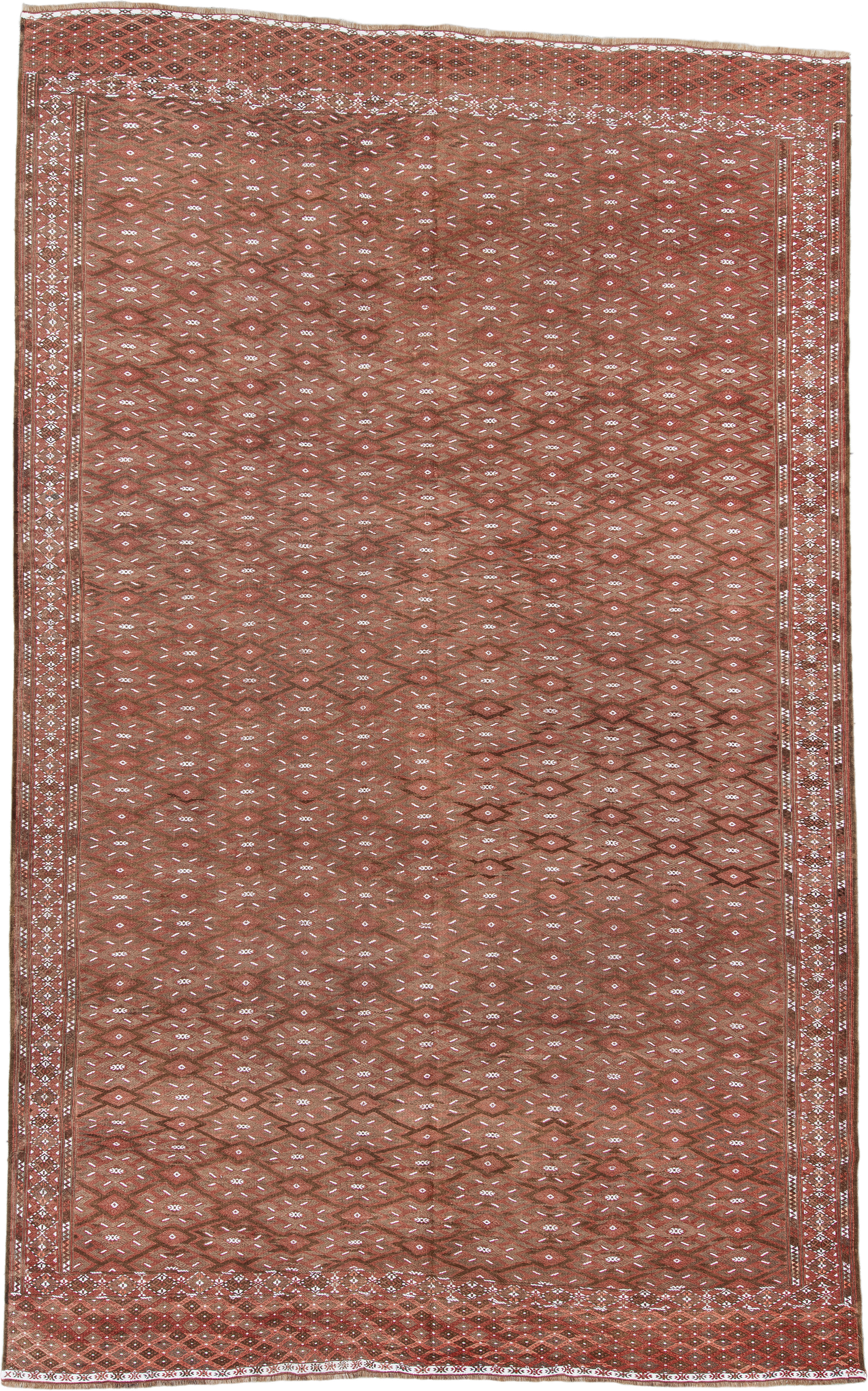 7' x 12' one-of-a-kind handmade antique Kilim large size rug. Color palette: rust, brown, ivory, terra cotta, taupe