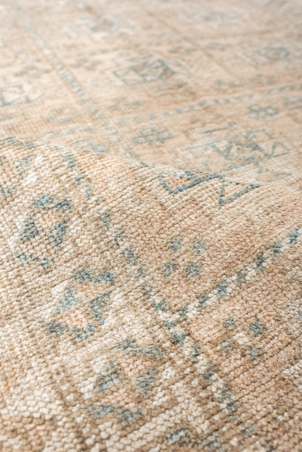 2' x 4' one-of-a-kind handmade vintage Belouch small size rug. Color palette: ivory, taupe, camel, pale blue, brown, sage