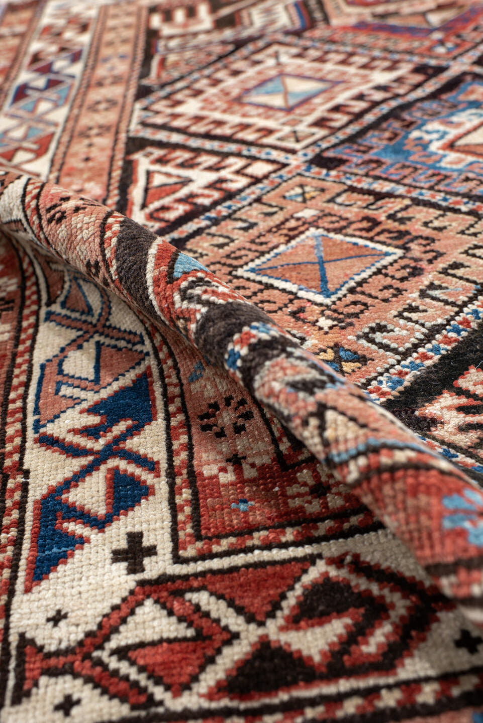 2' x 3' one-of-a-kind handmade antique Shirvan small size rug. Color palette: ivory, rust, brown, sky blue, navy, black