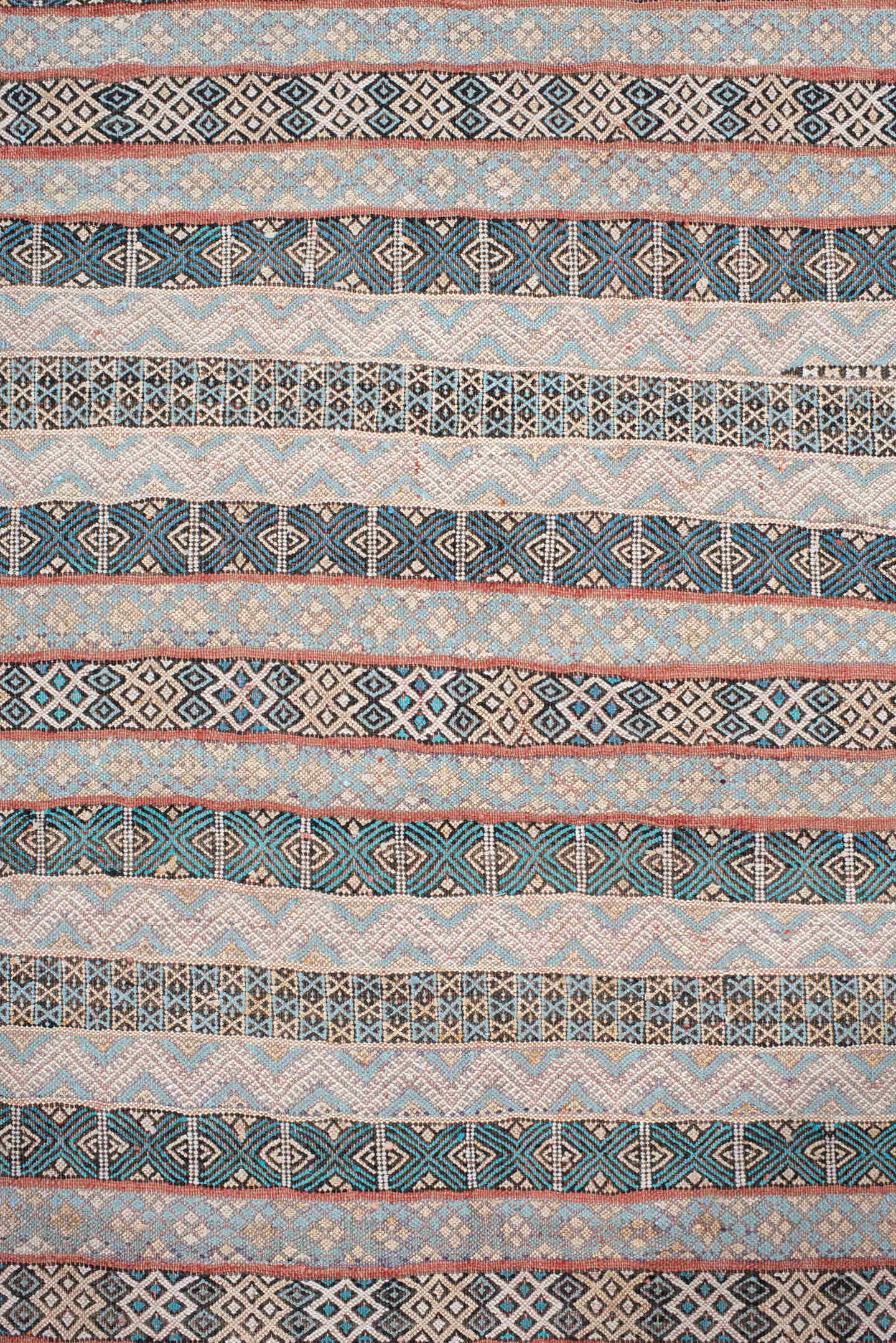 3' x 6' one-of-a-kind handmade vintage Moroccan small size rug. Color palette: ivory, indigo, sky blue, charcoal, rust