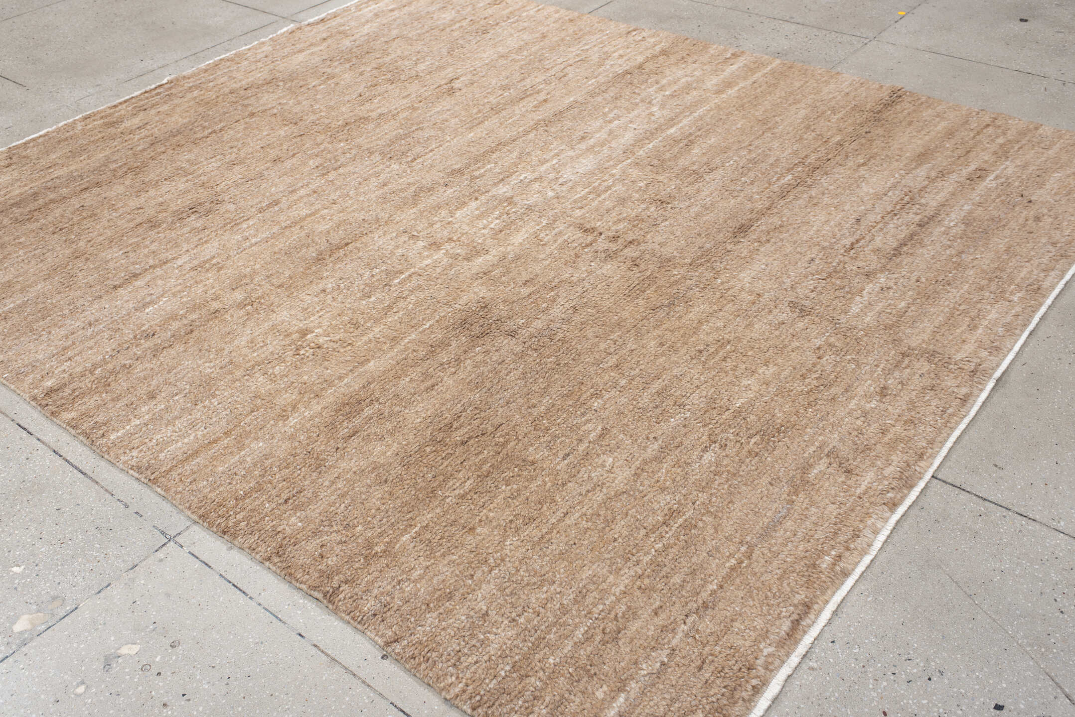 8' x 9' one-of-a-kind handmade vintage India rug. Color palette: tan, camel, taupe, beige, cream, gray, ivory