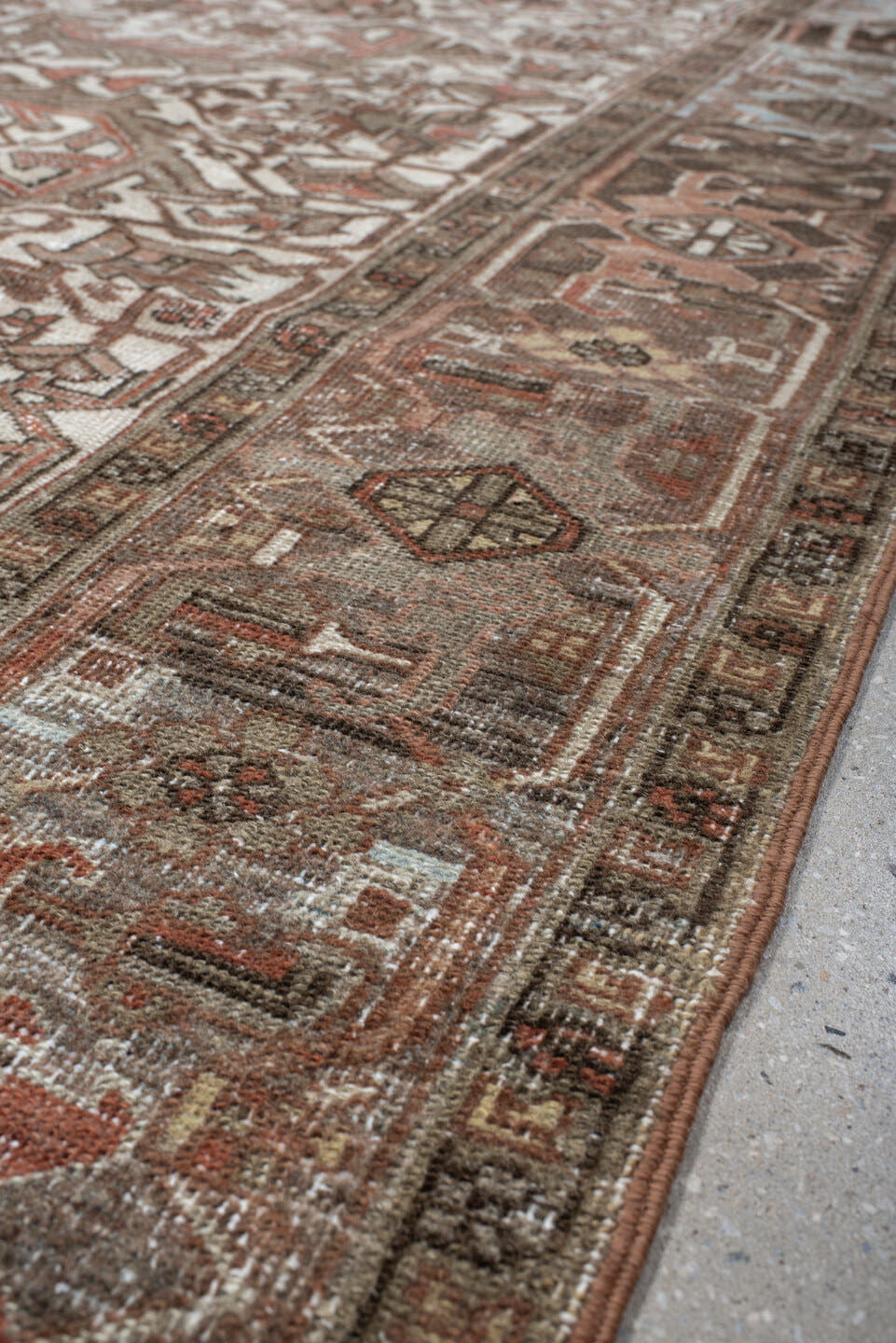 6' x 9' one-of-a-kind handmade antique Heriz medium size rug. Color palette: ivory, brown, sky_blue, rust, taupe, charcoal