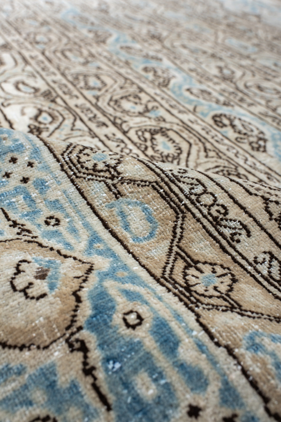 4' x 7' one-of-a-kind handmade antique Qum rug. Color palette: ivory, sky blue, taupe, brown, light blue, beige, gray