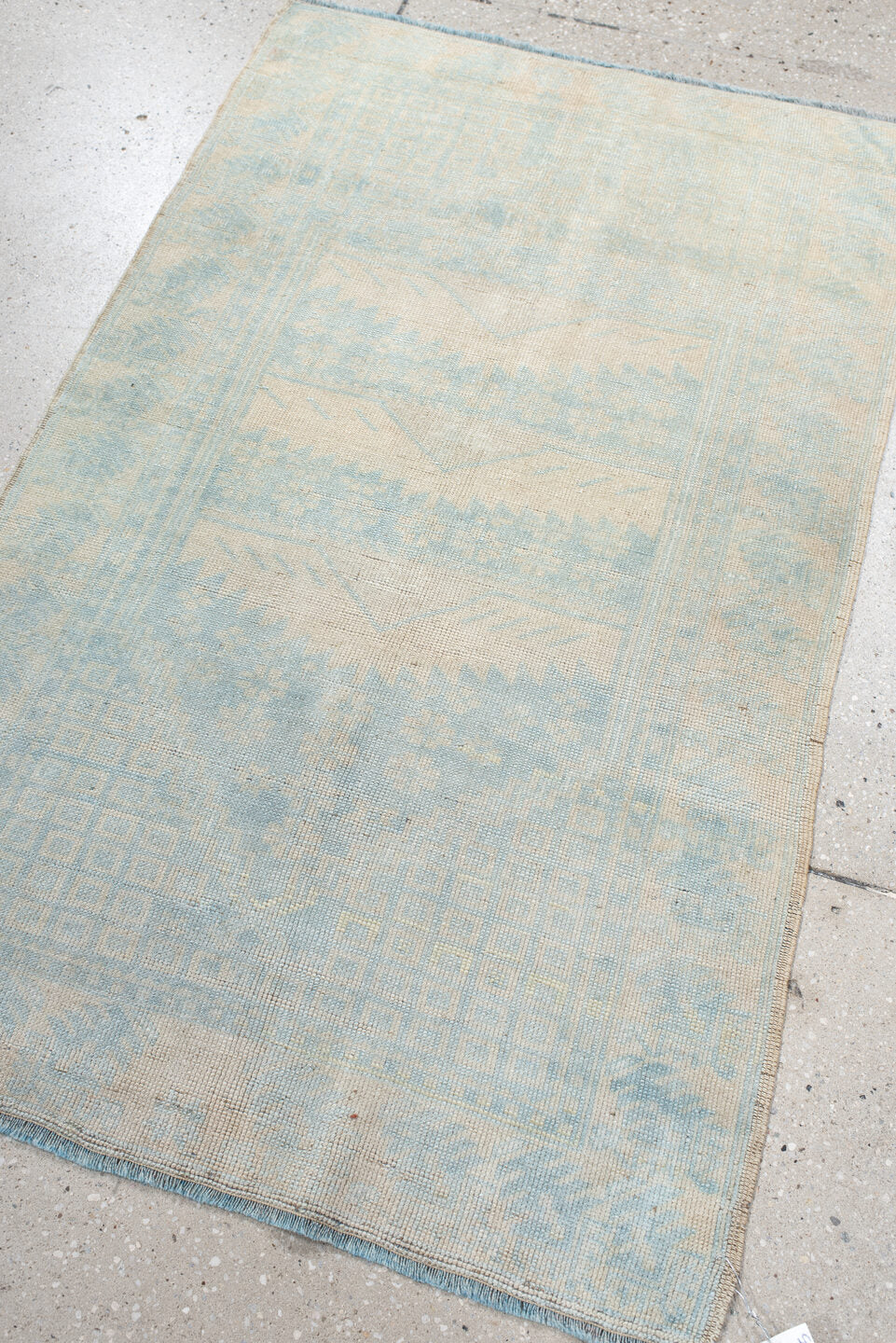 2' x 4' one-of-a-kind handmade vintage Anatolian small size rug. Color palette: ivory, pale blue, cream, sky blue