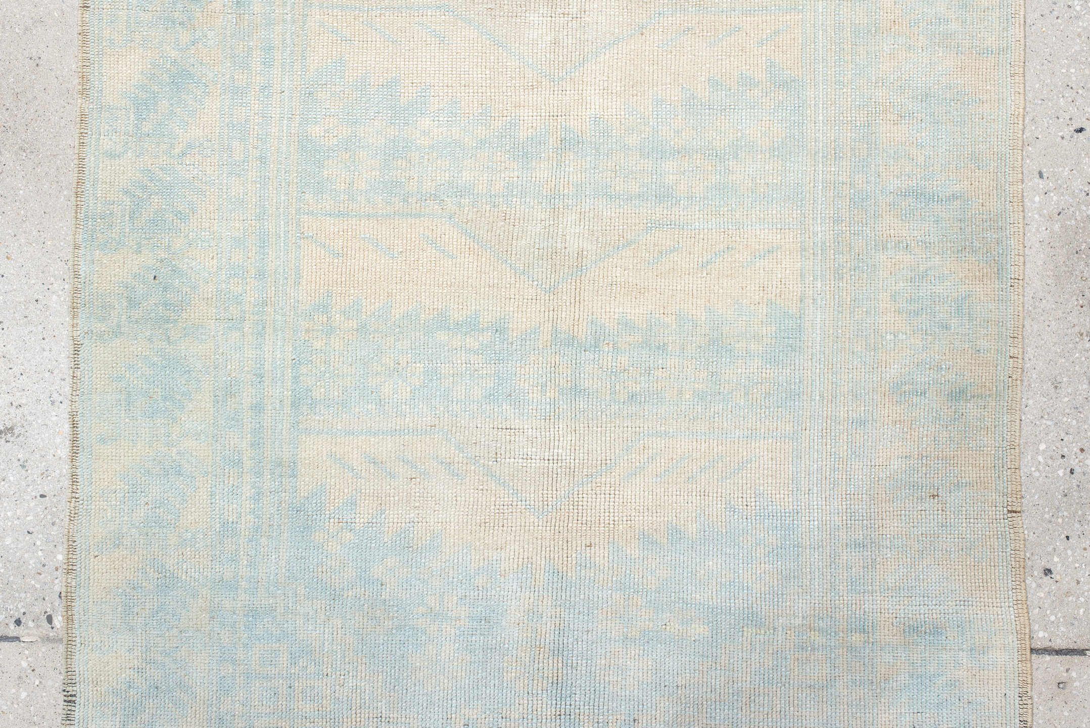 2' x 4' one-of-a-kind handmade vintage Anatolian small size rug. Color palette: ivory, pale blue, cream, sky blue