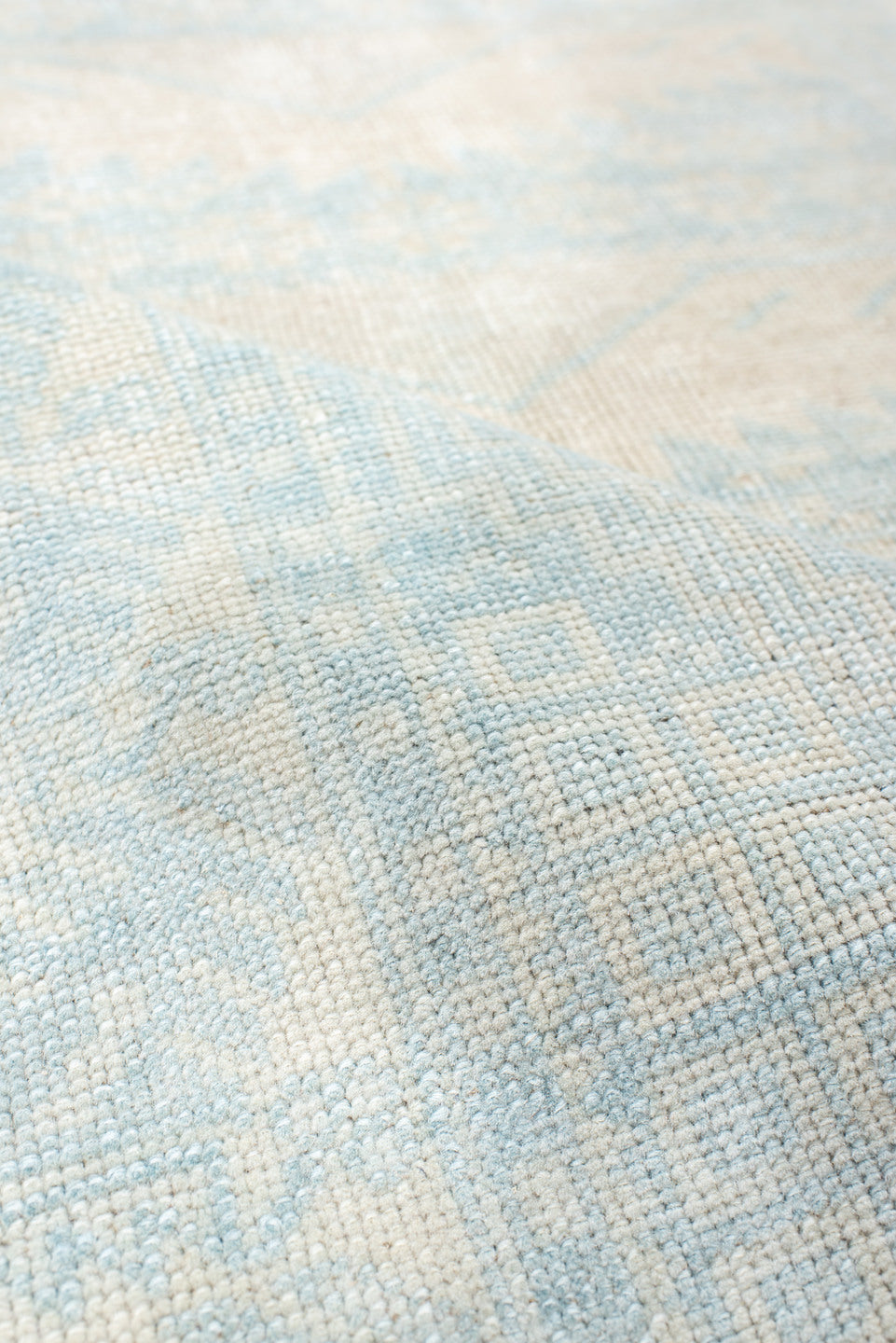 2' x 4' one-of-a-kind handmade vintage Anatolian small size rug. Color palette: ivory, pale blue, cream, sky blue