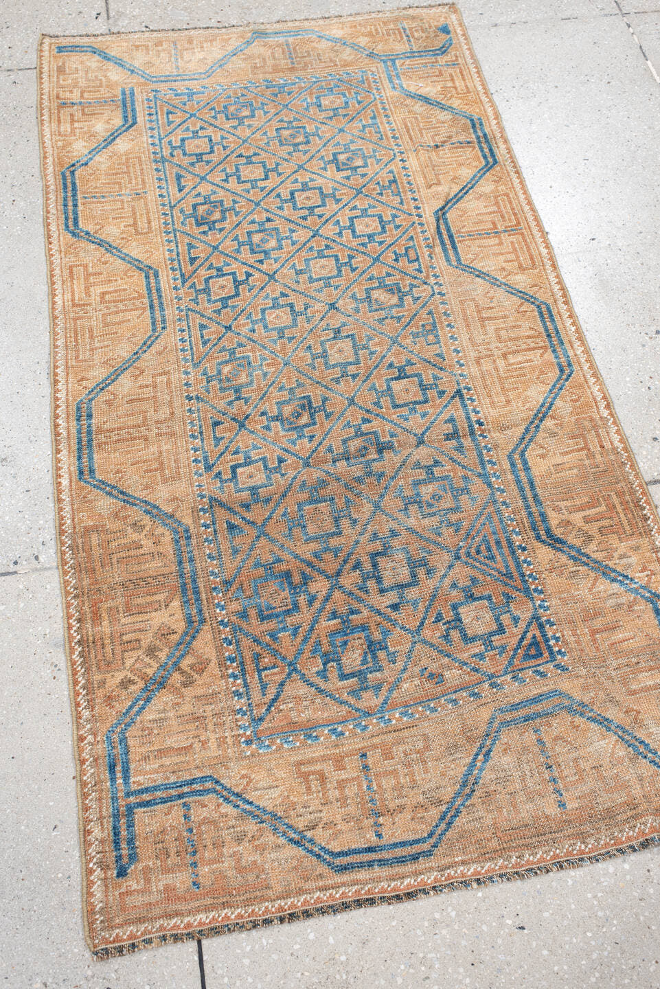 2' x 4' one-of-a-kind handmade antique Belouch small size rug. Color palette: peach, ivory, sky blue, camel, taupe