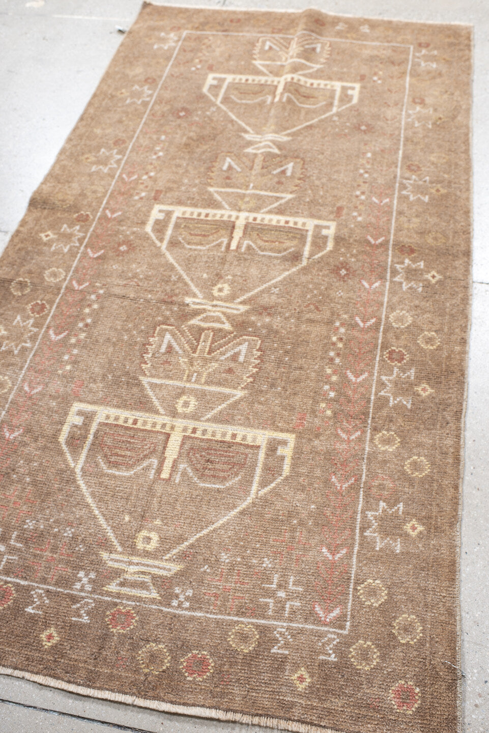 3' x 6' one-of-a-kind handmade antique Belouch small size rug. Color palette: camel, ivory, taupe, rose, rust, beige, gray