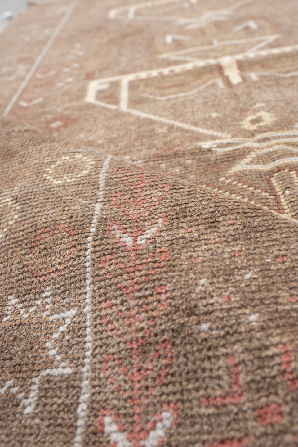 3' x 6' one-of-a-kind handmade antique Belouch small size rug. Color palette: camel, ivory, taupe, rose, rust, beige, gray