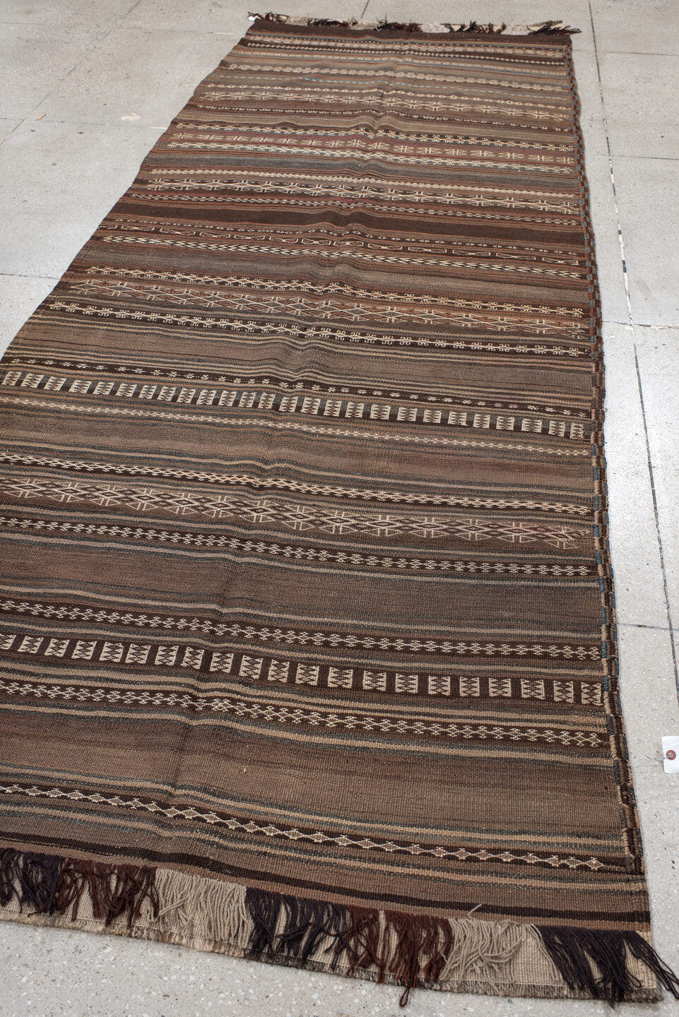 4' x 12' one-of-a-kind handmade antique Kilim runner rug. Color palette: brown, taupe, charcoal, ivory, camel, slate, beige