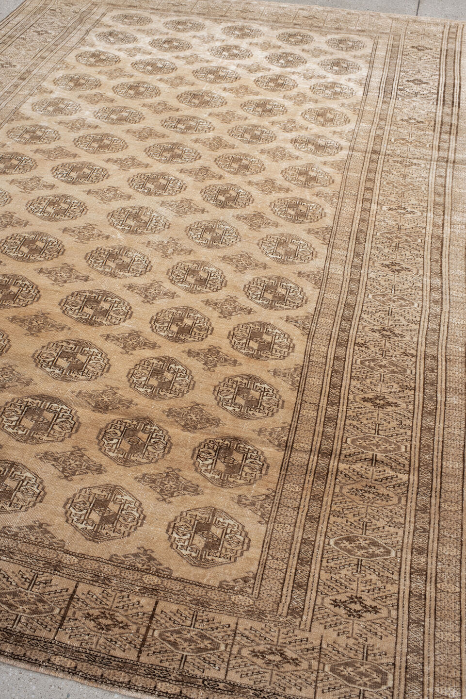 6' x 9' one-of-a-kind handmade antique Bokara medium size rug. Color palette: ivory, taupe, camel, beige, brown, gray