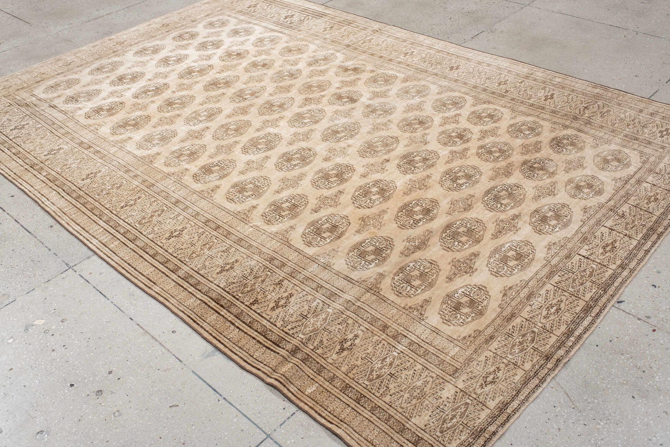6' x 9' one-of-a-kind handmade antique Bokara medium size rug. Color palette: ivory, taupe, camel, beige, brown, gray