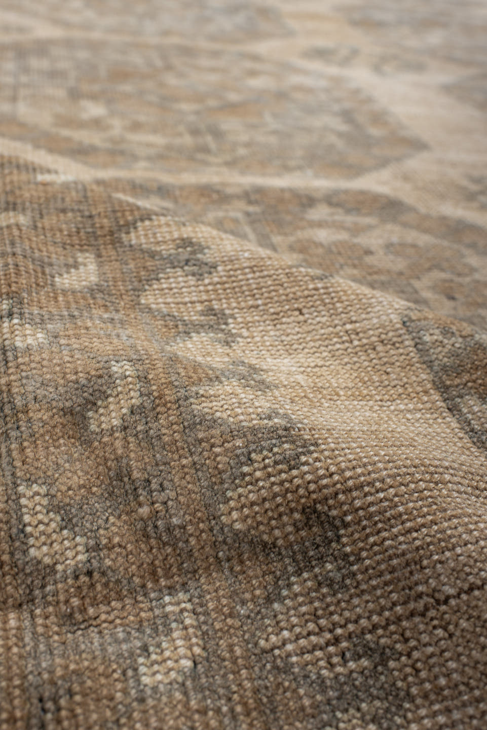 6' x 9' one-of-a-kind handmade antique Afghan rug. Color palette: ivory, taupe, beige, camel, sage, brown, gray, green