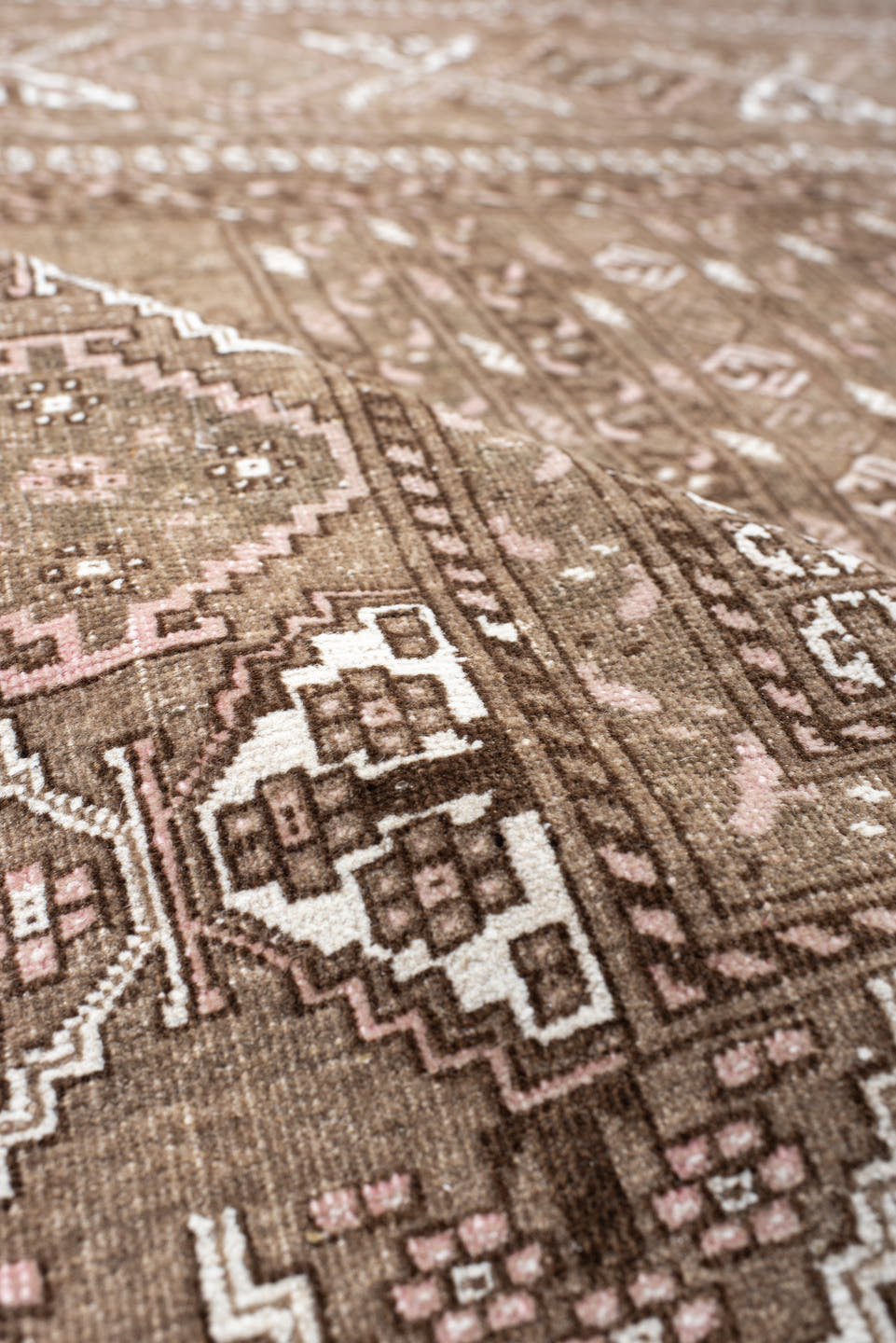 5' x 7' one-of-a-kind handmade vintage  rug. Color palette: taupe, brown, ivory, blush, camel, beige, gray, pink