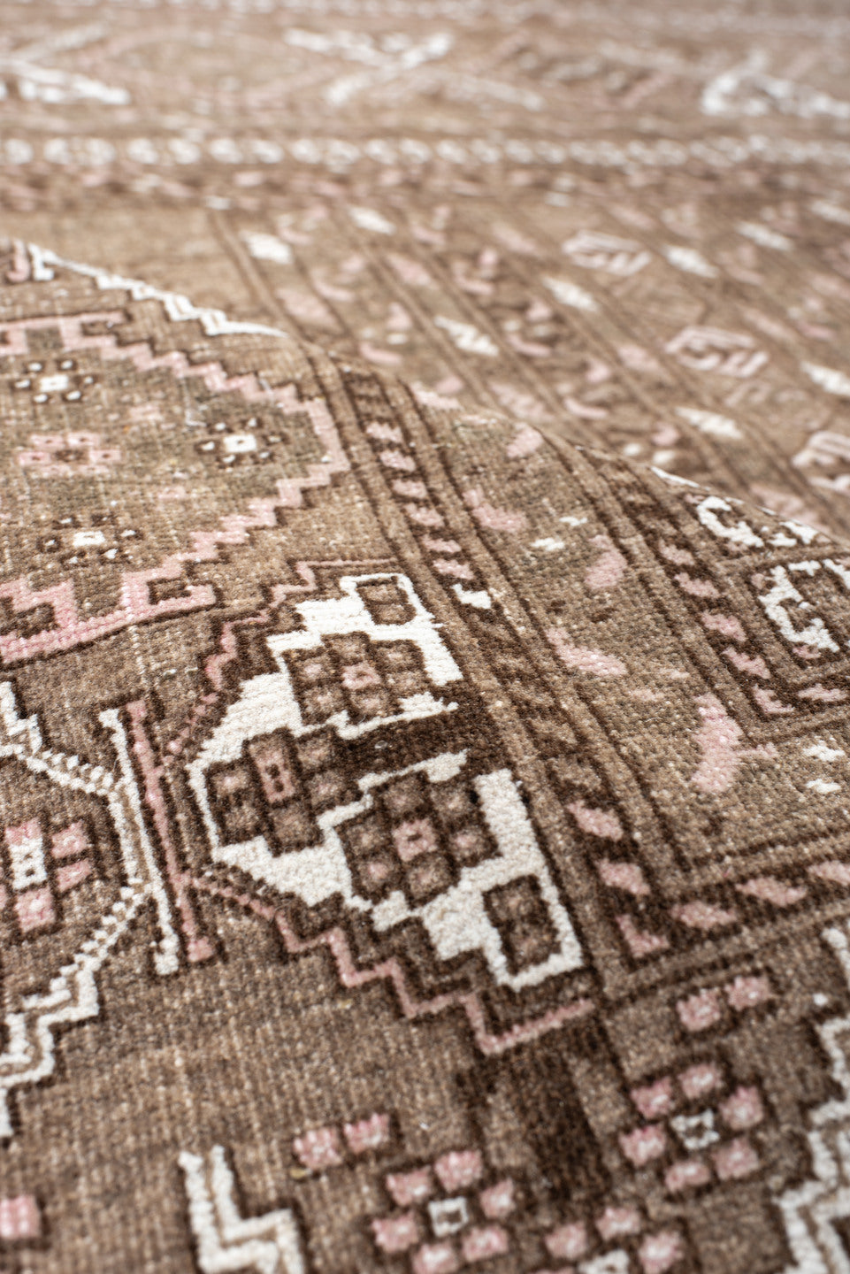 5' x 7' one-of-a-kind handmade vintage  rug. Color palette: taupe, brown, ivory, blush, camel, beige, gray, pink