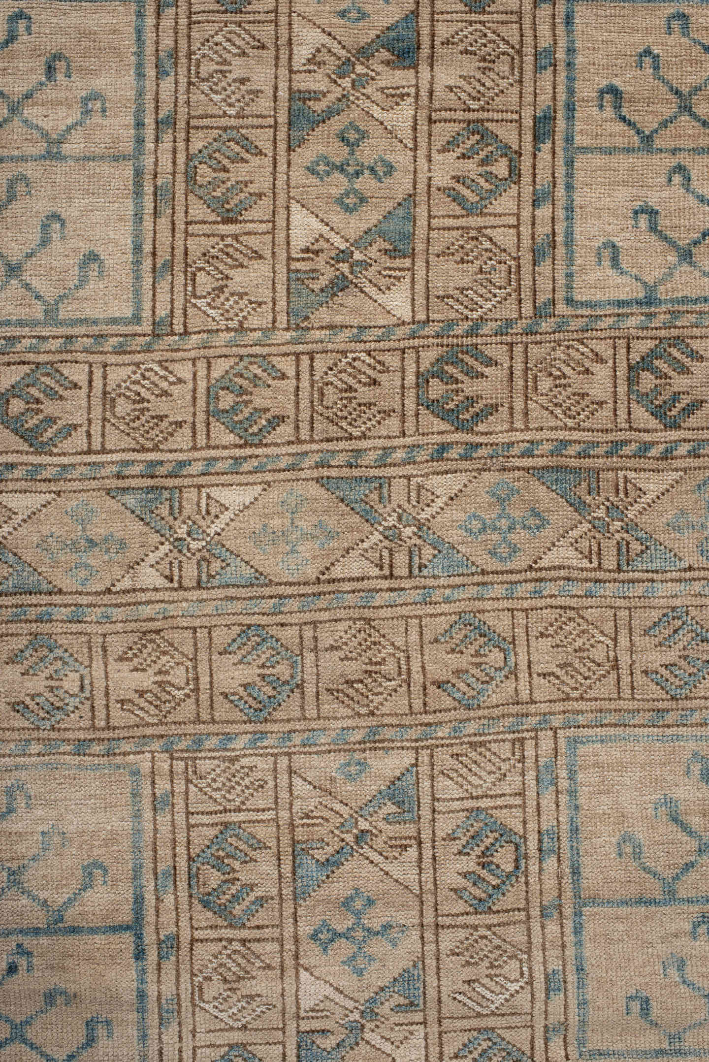 5' x 7' one-of-a-kind handmade antique Afghan rug. Color palette: ivory, taupe, teal, camel, beige, gray