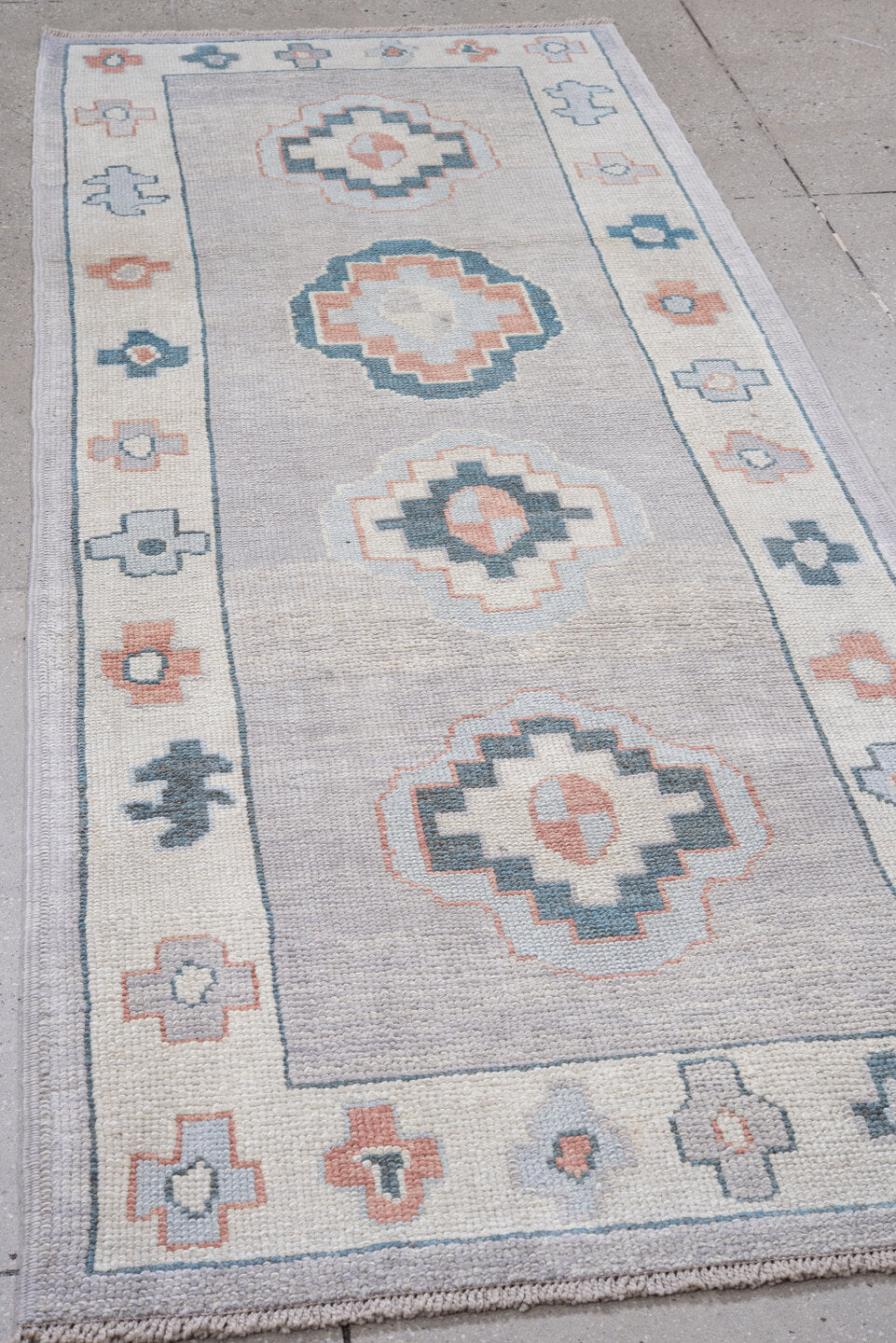 3' x 9' one-of-a-kind handmade vintage Oushak runner rug. Color palette: ivory, powder_blue, blush, pale_gray, slate, peach