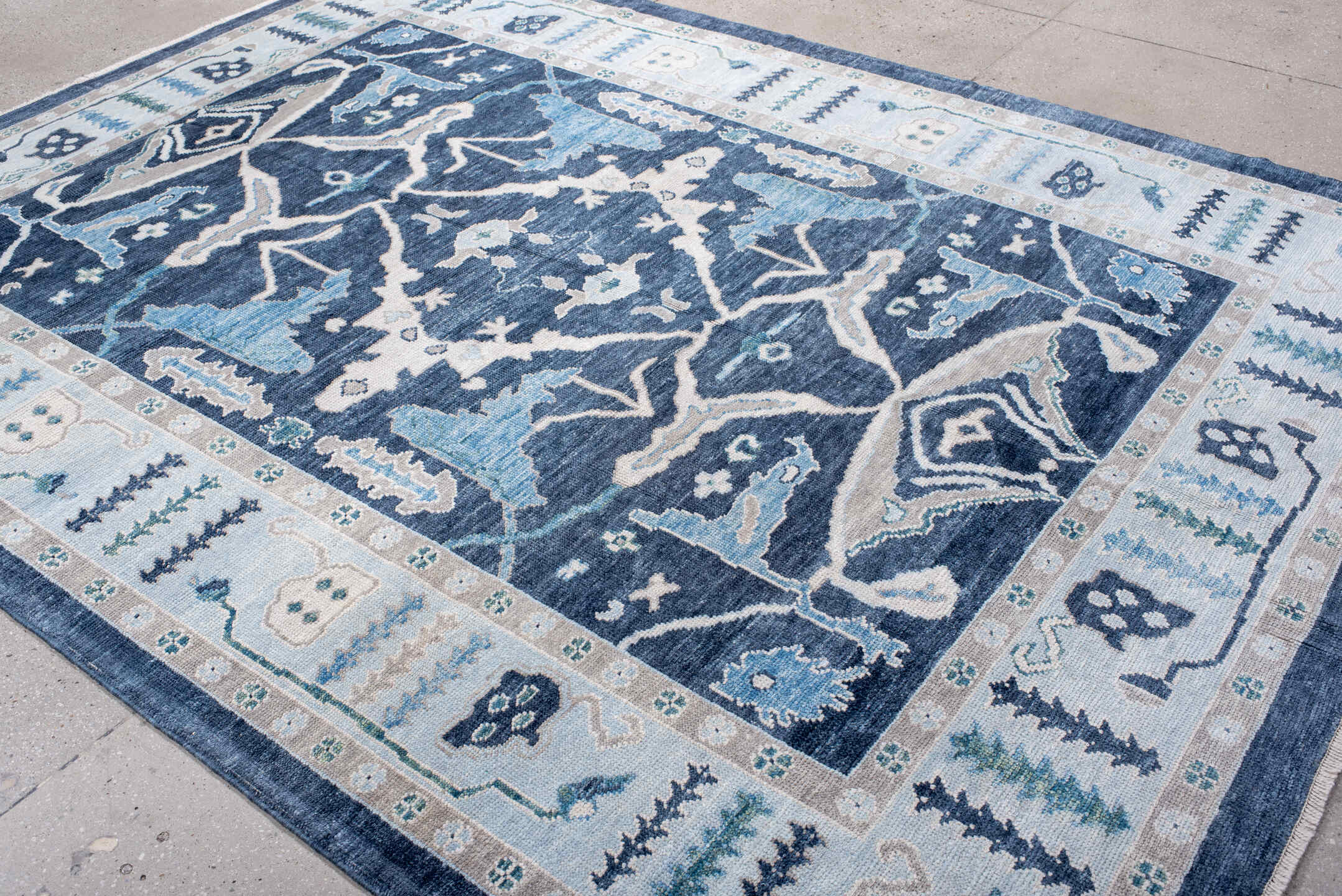 7' x 10' one-of-a-kind handmade vintage Oushak large size rug. Color palette: navy, ivory, sky blue, taupe, slate, aqua