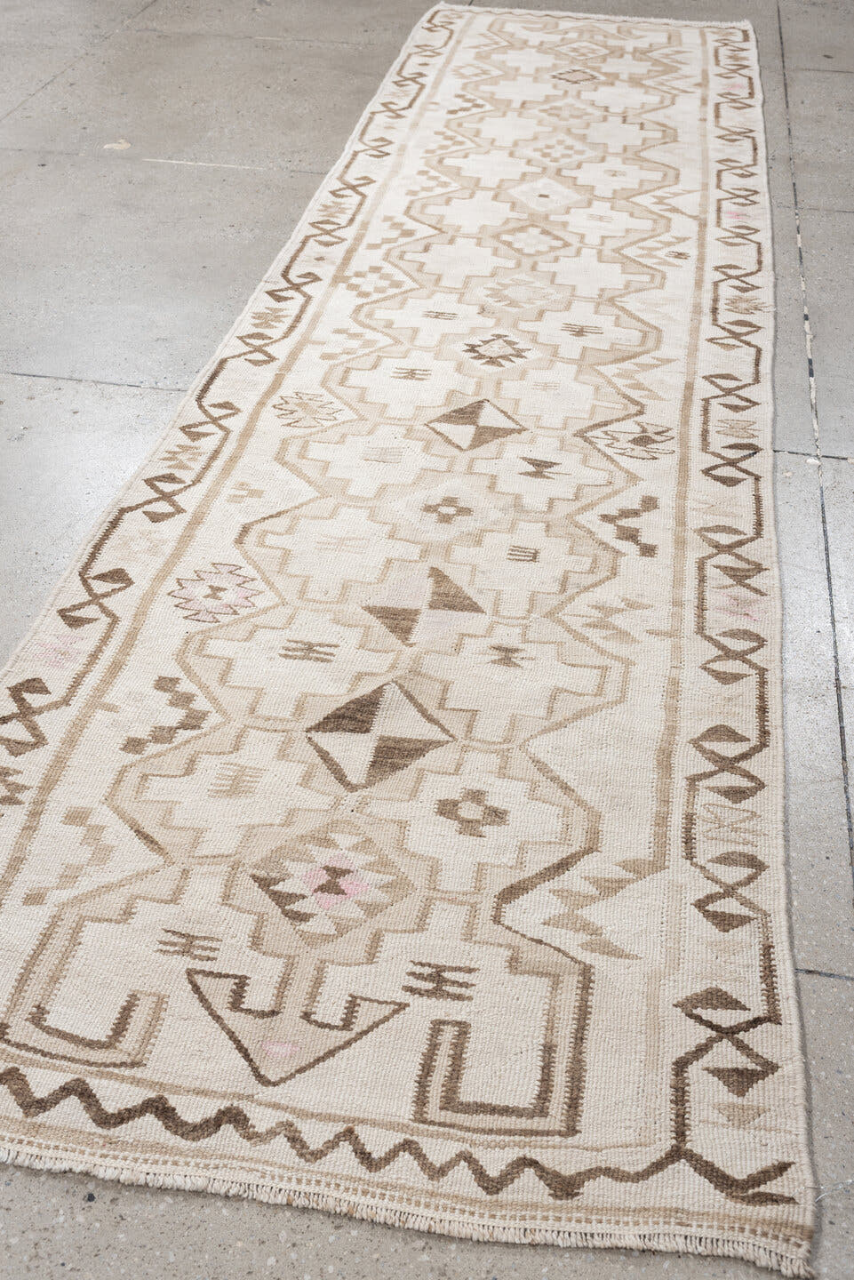 2' x 10' one-of-a-kind handmade antique Kilim runner rug. Color palette: ivory, taupe, brown, camel, blush, beige, gray