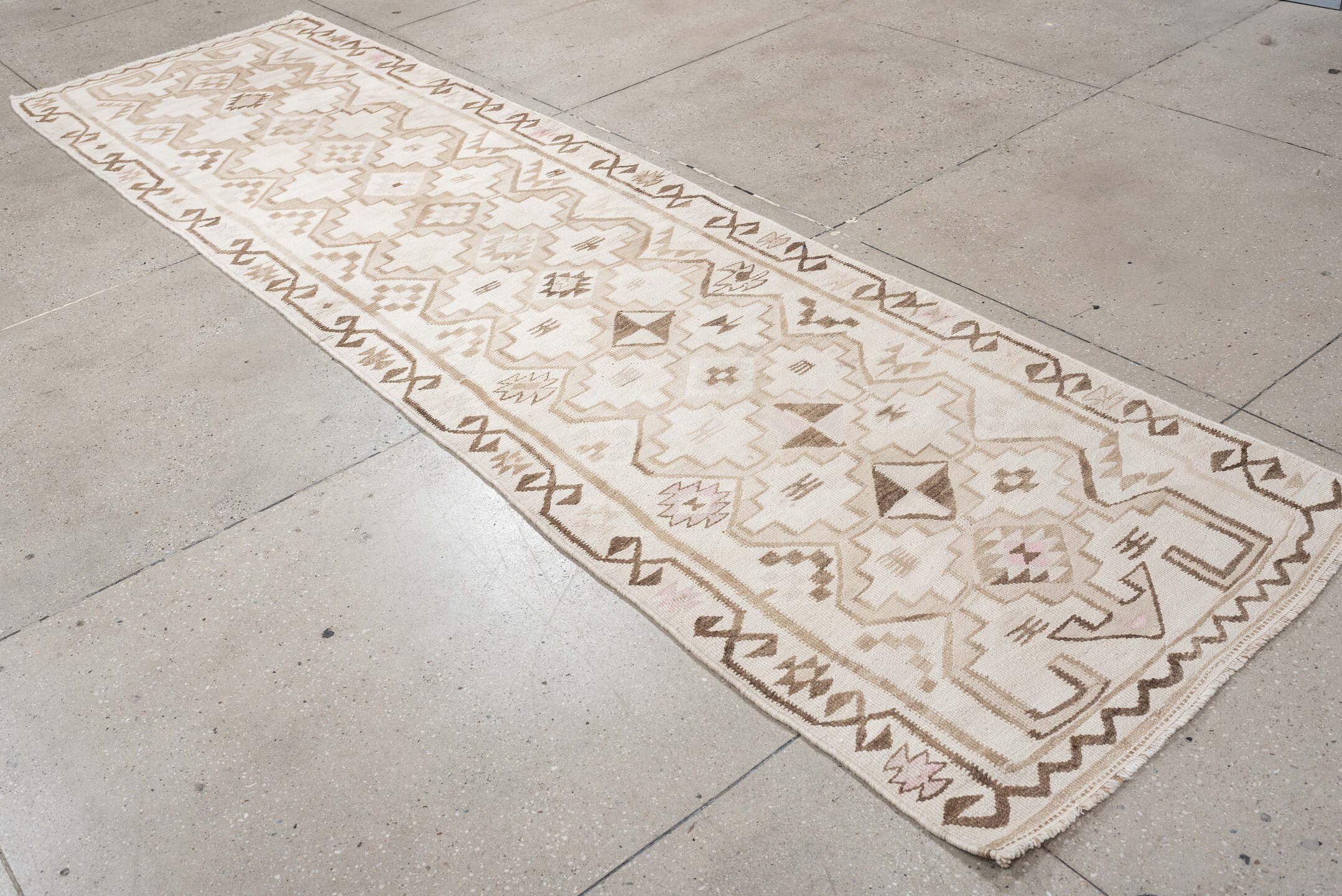 2' x 10' one-of-a-kind handmade antique Kilim runner rug. Color palette: ivory, taupe, brown, camel, blush, beige, gray