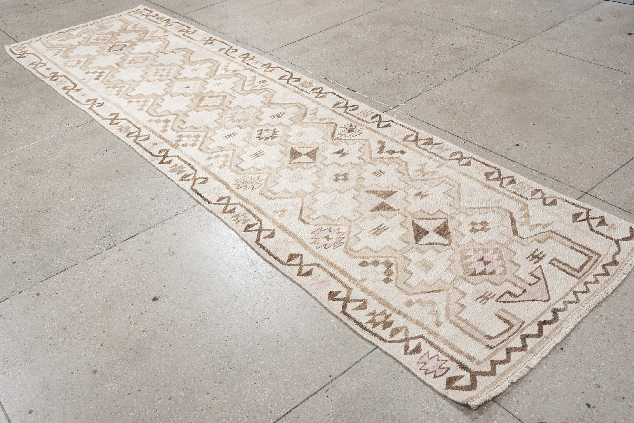 2' x 10' one-of-a-kind handmade antique Kilim runner rug. Color palette: ivory, taupe, brown, camel, blush, beige, gray