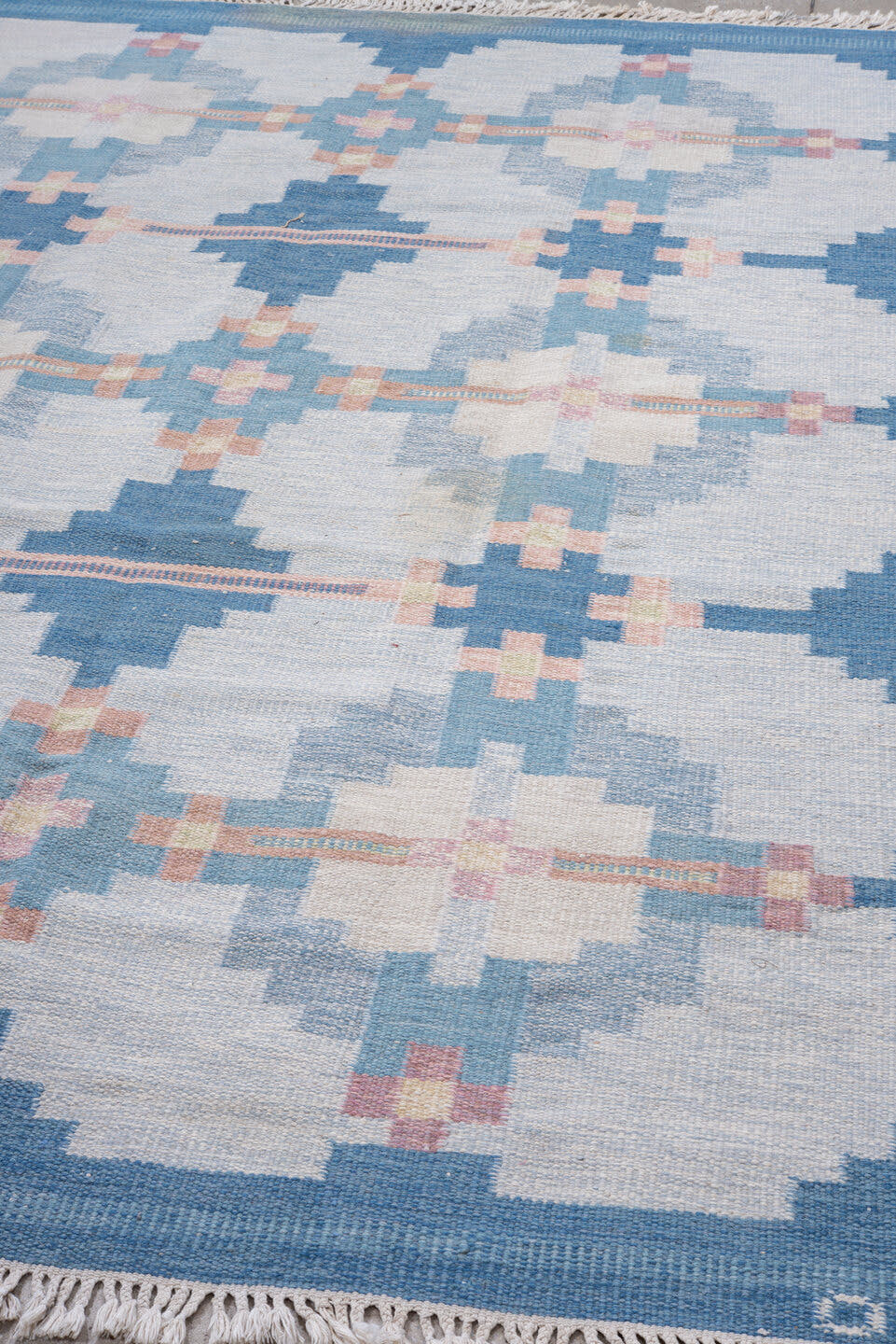 6' x 9' one-of-a-kind handmade vintage Rollaken medium size rug. Color palette: sky blue, ivory, pale blue, blush, cream