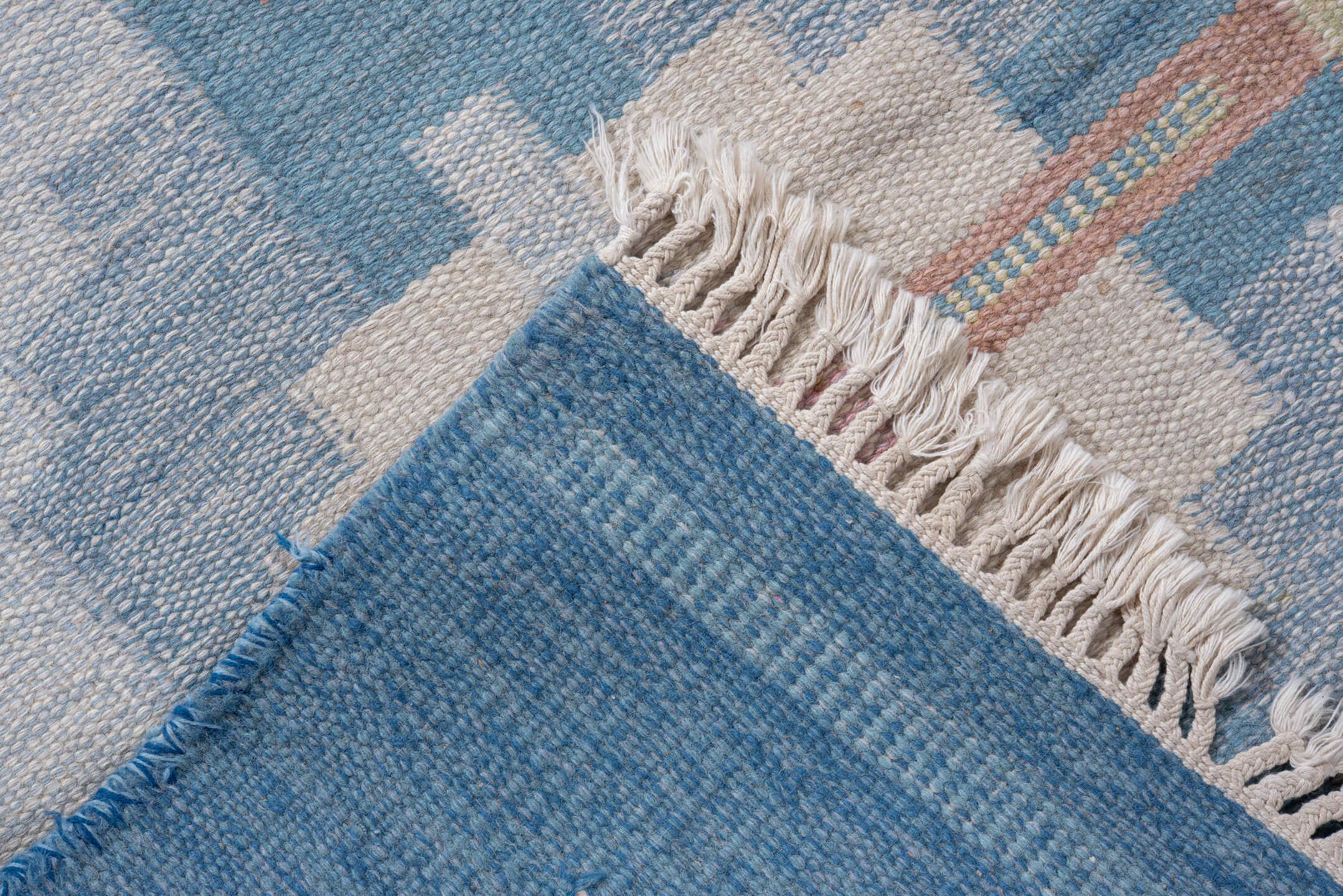 6' x 9' one-of-a-kind handmade vintage Rollaken medium size rug. Color palette: sky blue, ivory, pale blue, blush, cream