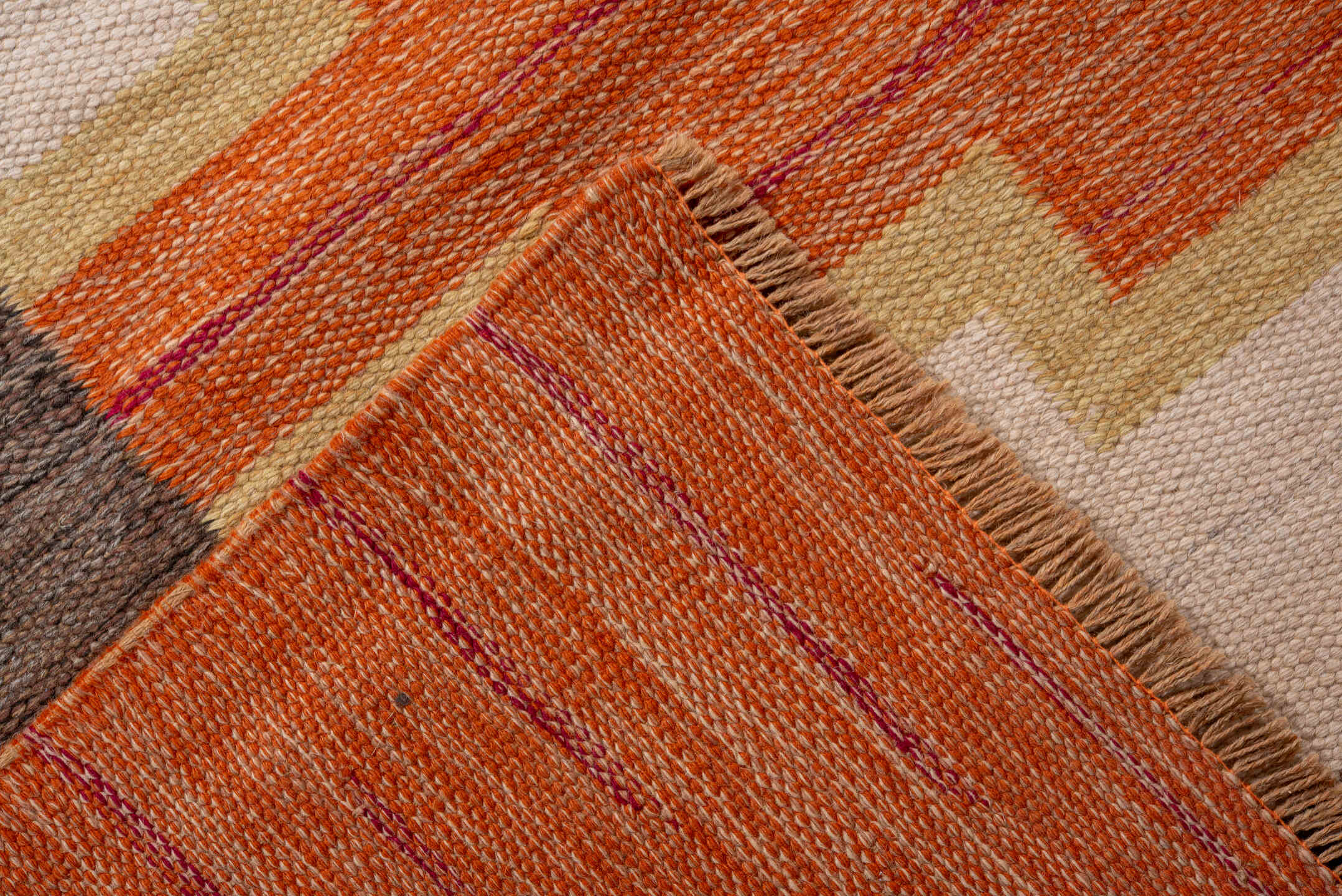 6' x 9' one-of-a-kind handmade antique Rollaken medium size rug. Color palette: orange, ivory, taupe, gold, navy, slate