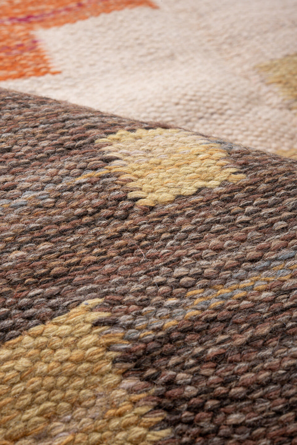 6' x 9' one-of-a-kind handmade antique Rollaken medium size rug. Color palette: orange, ivory, taupe, gold, navy, slate