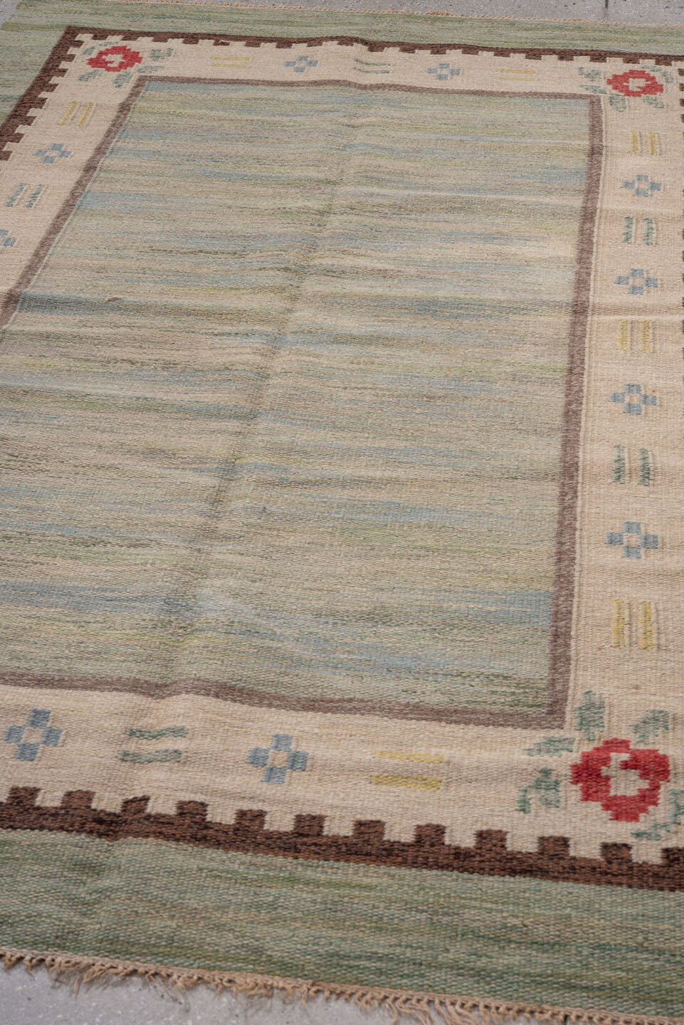 5' x 8' one-of-a-kind handmade antique Rollaken medium size rug. Color palette: sage, ivory, sky blue, brown, rose