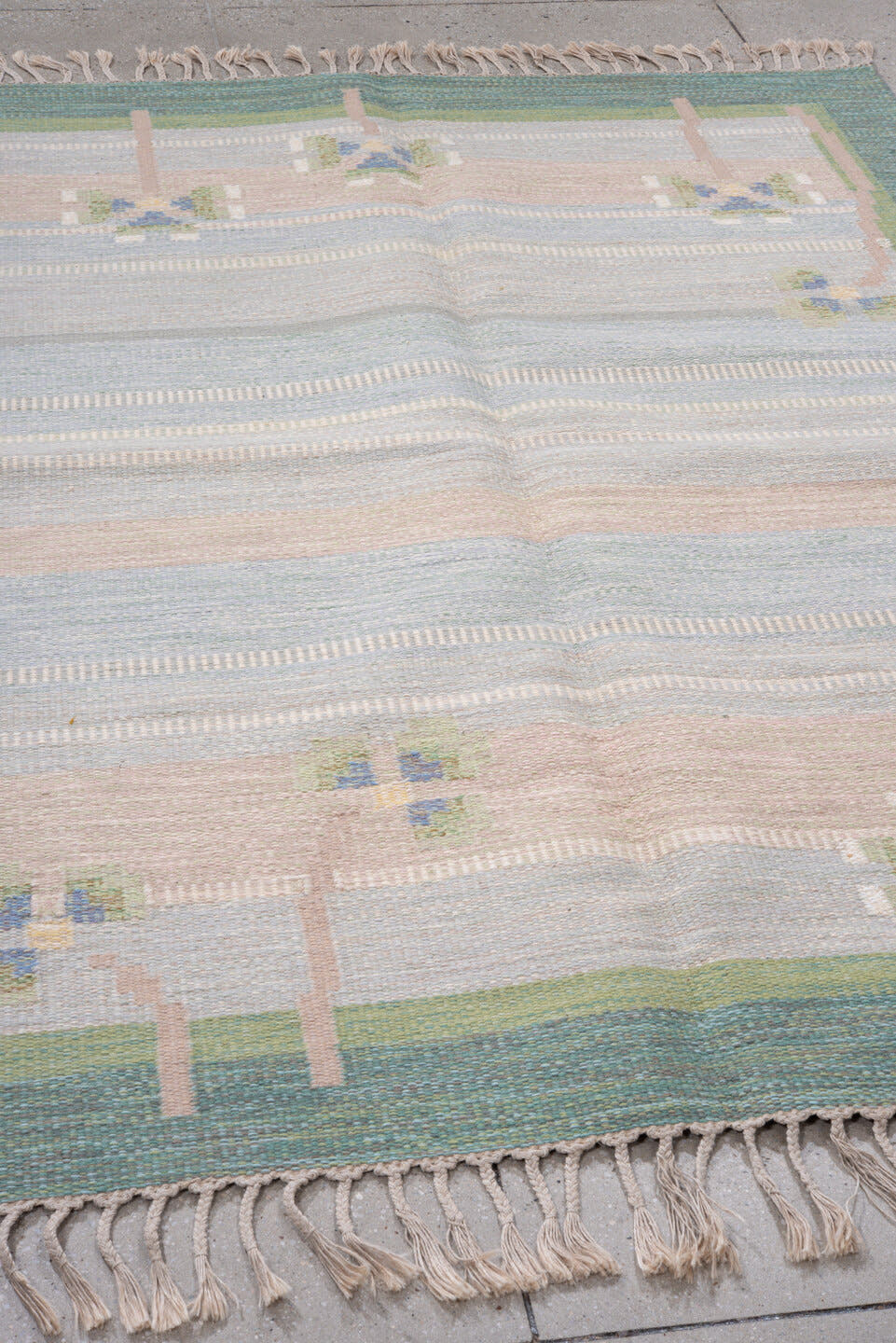 5' x 7' one-of-a-kind handmade antique Rollaken rug. Color palette: pale blue, seafoam, blush, ivory, sage, teal