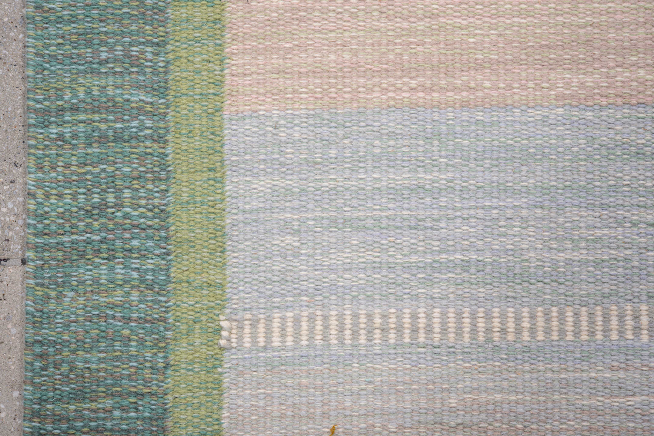 5' x 7' one-of-a-kind handmade antique Rollaken rug. Color palette: pale blue, seafoam, blush, ivory, sage, teal