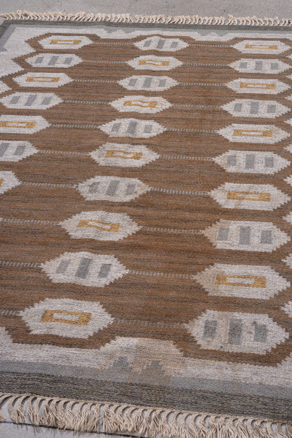 5' x 7' one-of-a-kind handmade antique Rollaken rug. Color palette: brown, ivory, gray, taupe, gold, beige