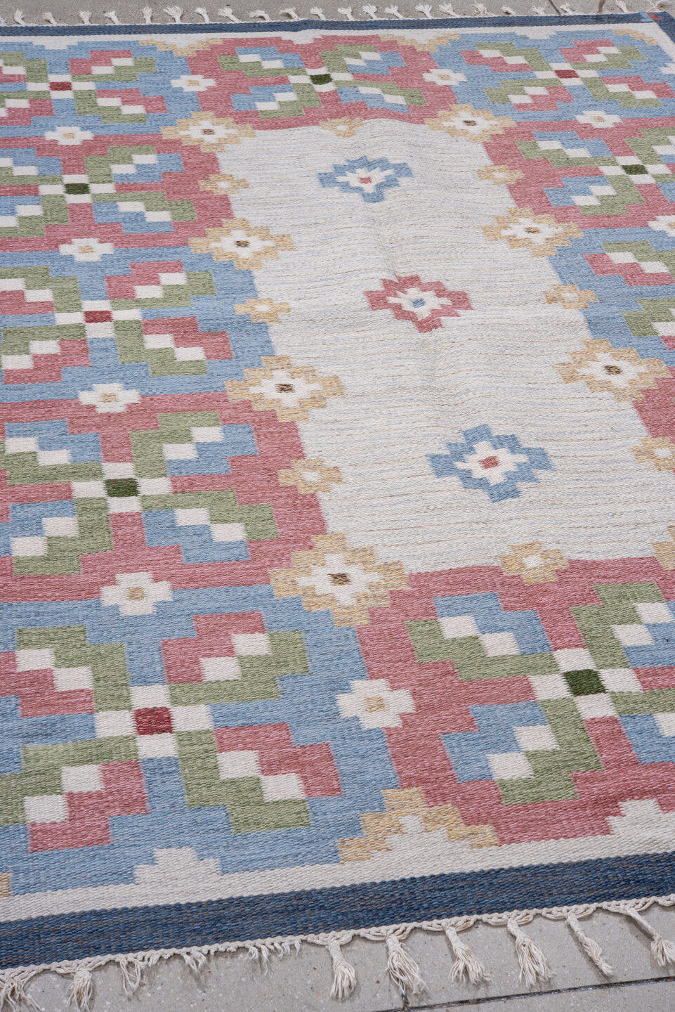 5' x 8' one-of-a-kind handmade antique Rollaken medium size rug. Color palette: ivory, dusty rose, sky blue, slate, sage