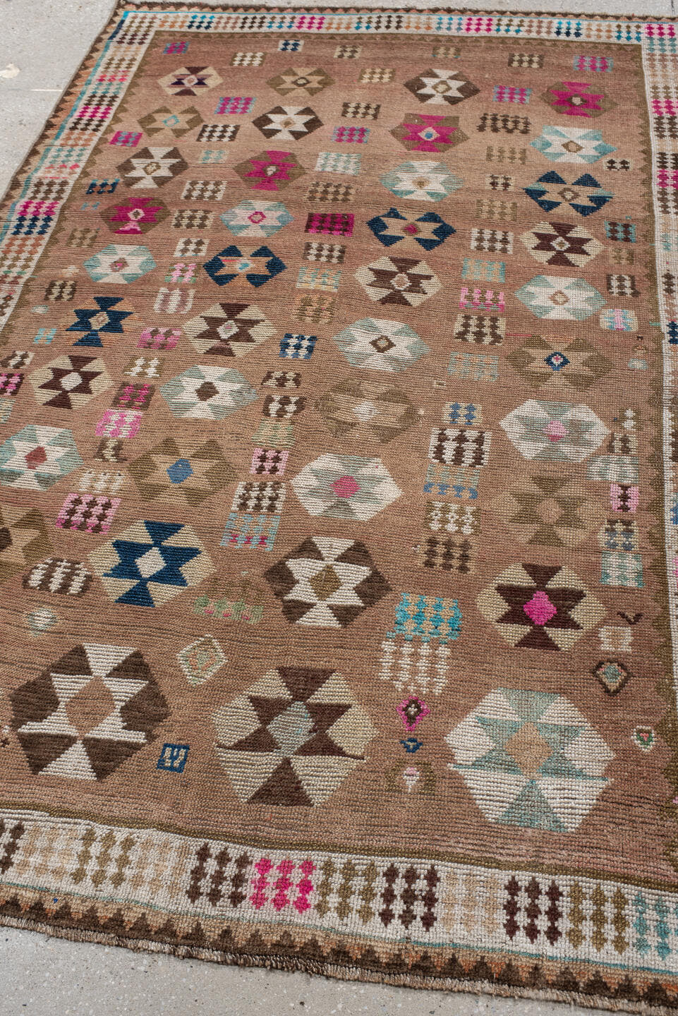 4' x 7' one-of-a-kind handmade vintage Gabbe rug. Color palette: camel, ivory, brown, turquoise, magenta, taupe, navy, rose