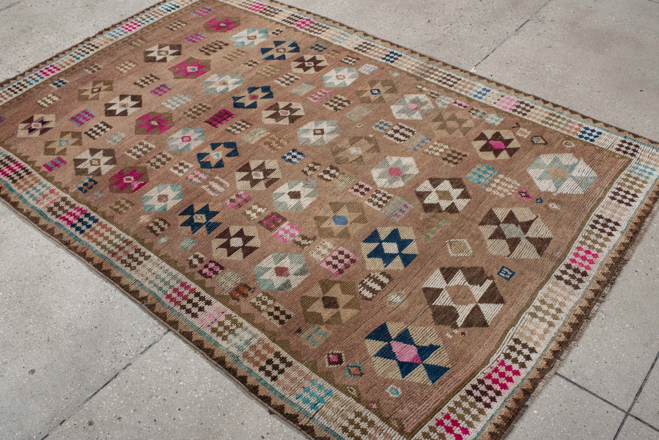 4' x 7' one-of-a-kind handmade vintage Gabbe rug. Color palette: camel, ivory, brown, turquoise, magenta, taupe, navy, rose