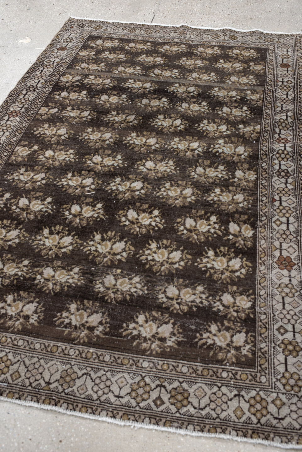 4' x 7' one-of-a-kind handmade vintage  rug. Color palette: brown, ivory, taupe, camel, charcoal, gold, rust, beige, gray