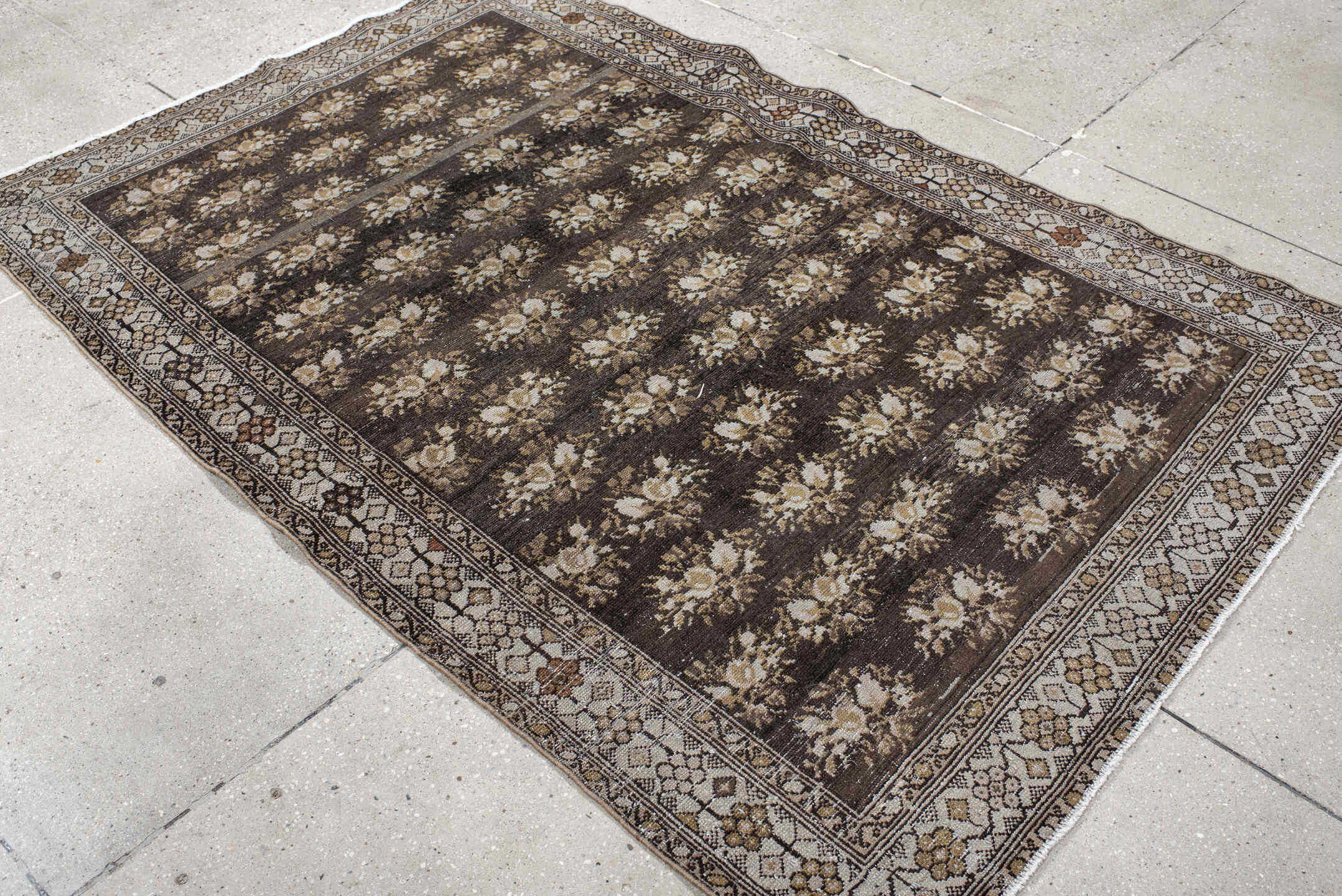 4' x 7' one-of-a-kind handmade vintage  rug. Color palette: brown, ivory, taupe, camel, charcoal, gold, rust, beige, gray