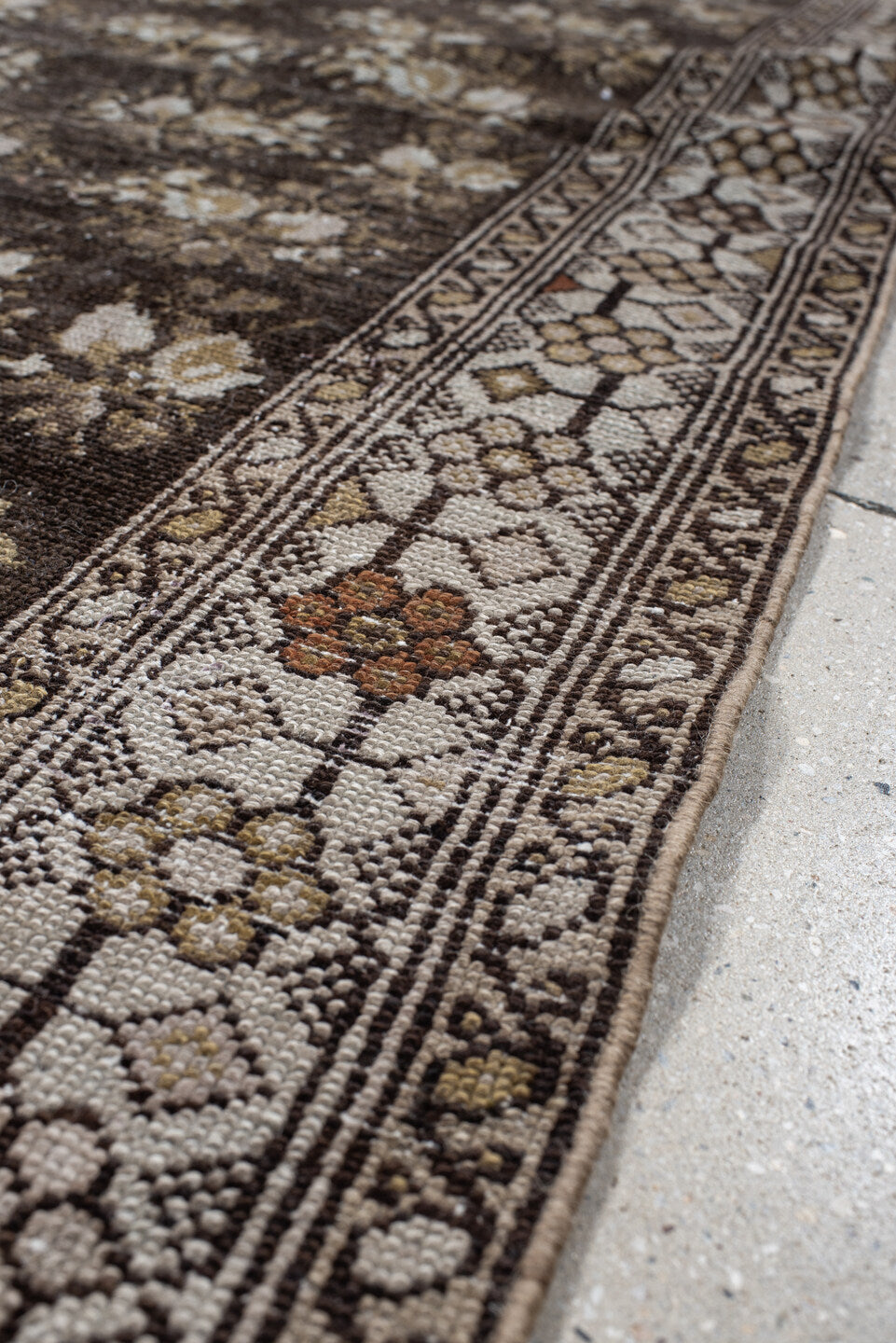 4' x 7' one-of-a-kind handmade vintage  rug. Color palette: brown, ivory, taupe, camel, charcoal, gold, rust, beige, gray
