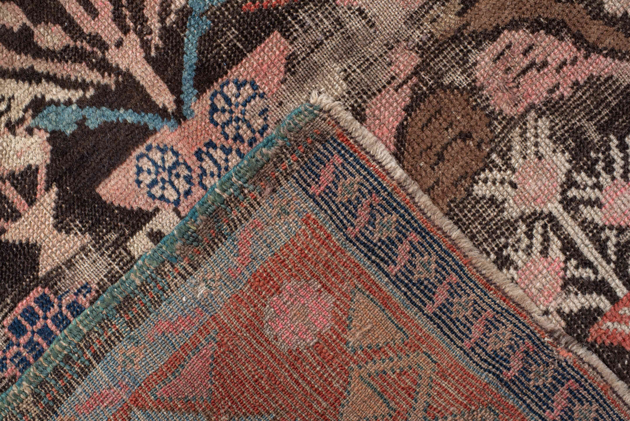 4' x 8' one-of-a-kind handmade vintage Karabagh rug. Color palette: charcoal, rust, ivory, turquoise, rose, taupe, navy