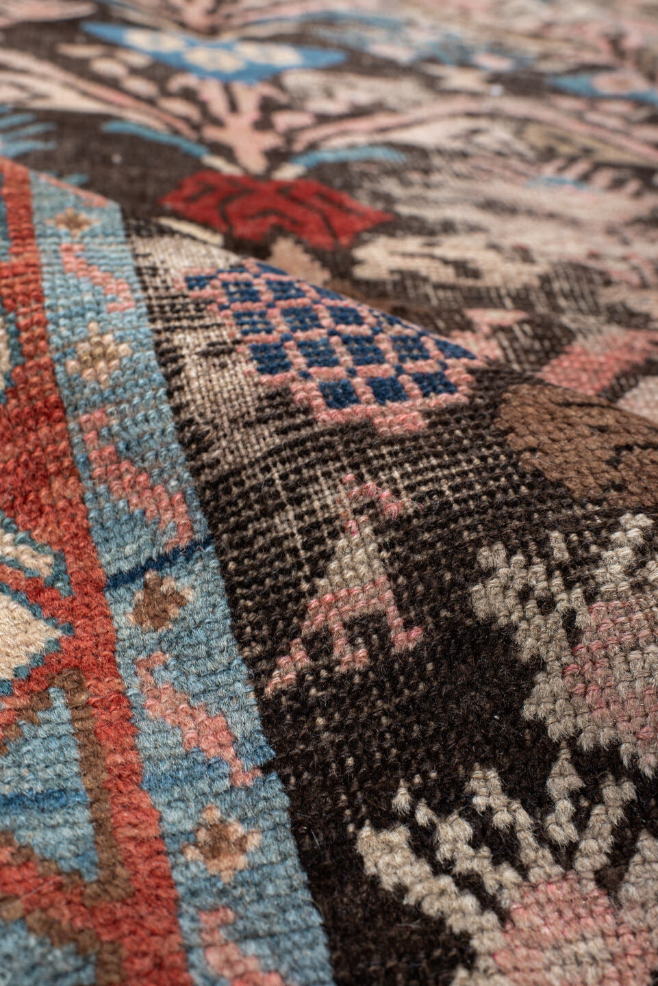 4' x 8' one-of-a-kind handmade vintage Karabagh rug. Color palette: charcoal, rust, ivory, turquoise, rose, taupe, navy