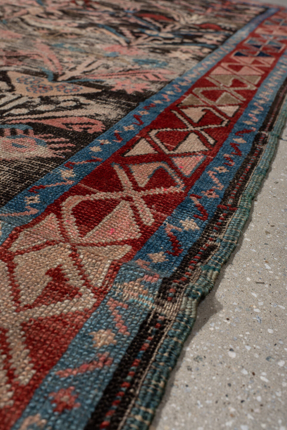 4' x 8' one-of-a-kind handmade vintage Karabagh rug. Color palette: charcoal, rust, ivory, turquoise, rose, taupe, navy