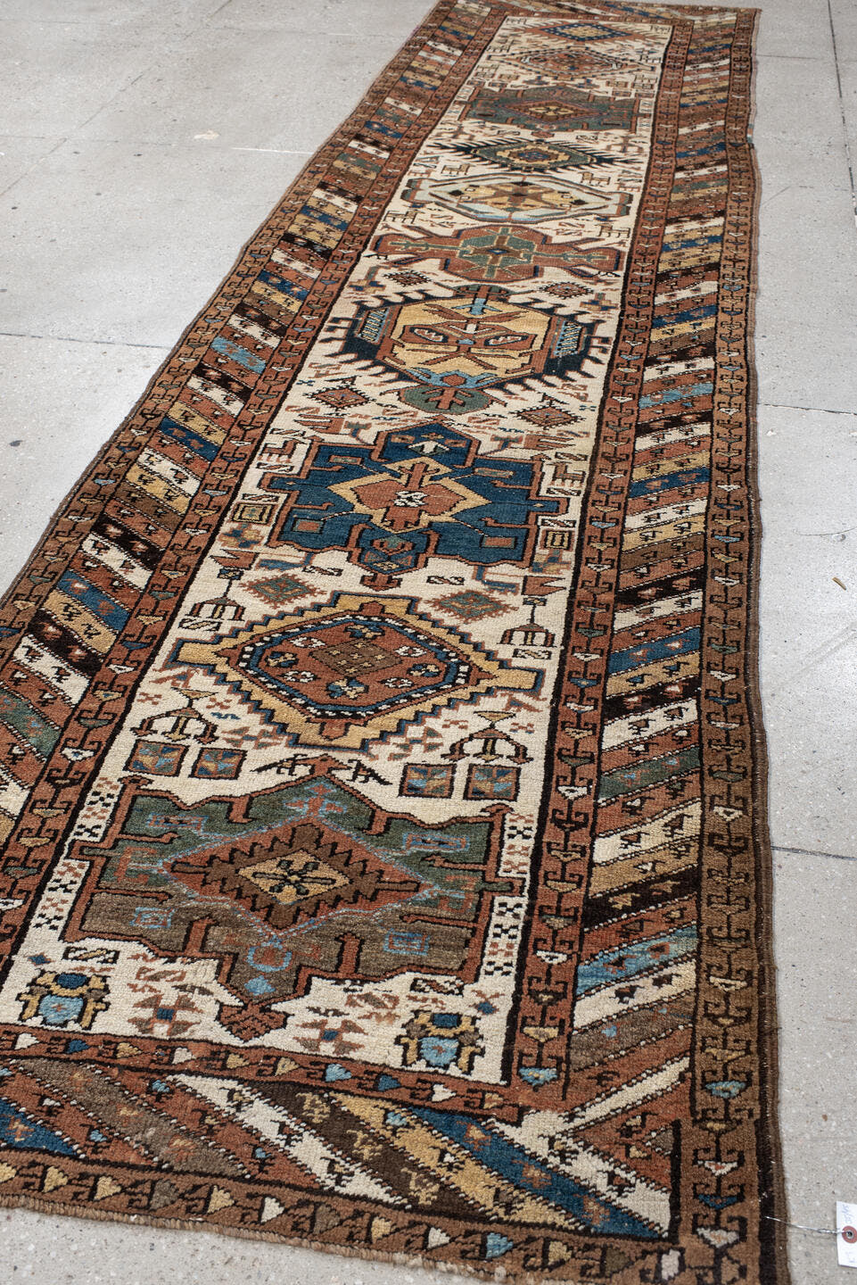 3' x 12' one-of-a-kind handmade vintage NW Persian runner rug. Color palette: ivory, rust, camel, blue, brown, teal, taupe