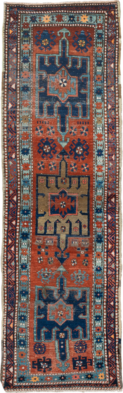 2' x 8' one-of-a-kind handmade vintage Heriz runner rug. Color palette: rust, navy, sky blue, ivory, camel, coral, charcoal